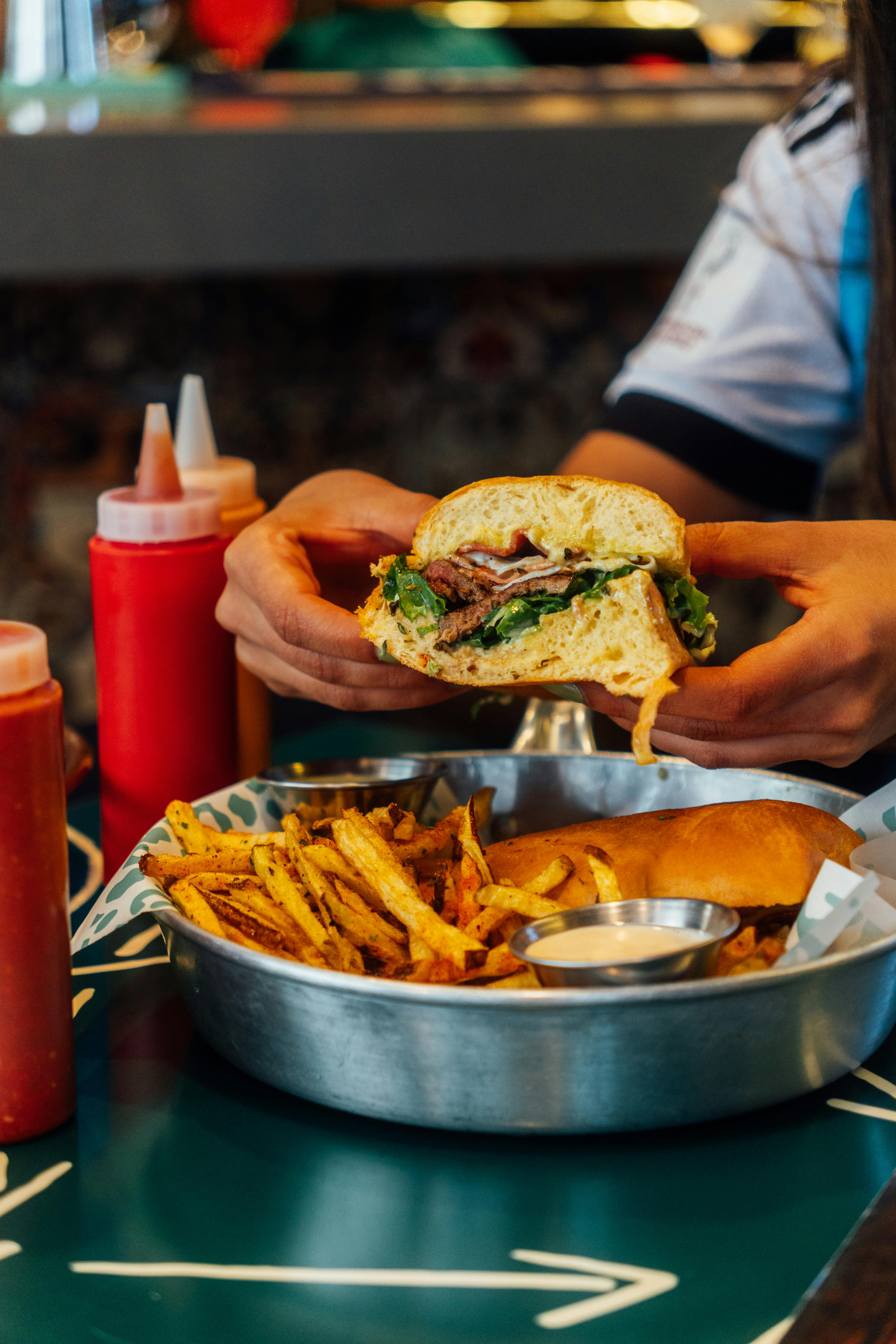 gourmet burger and fries in a restaurant setting