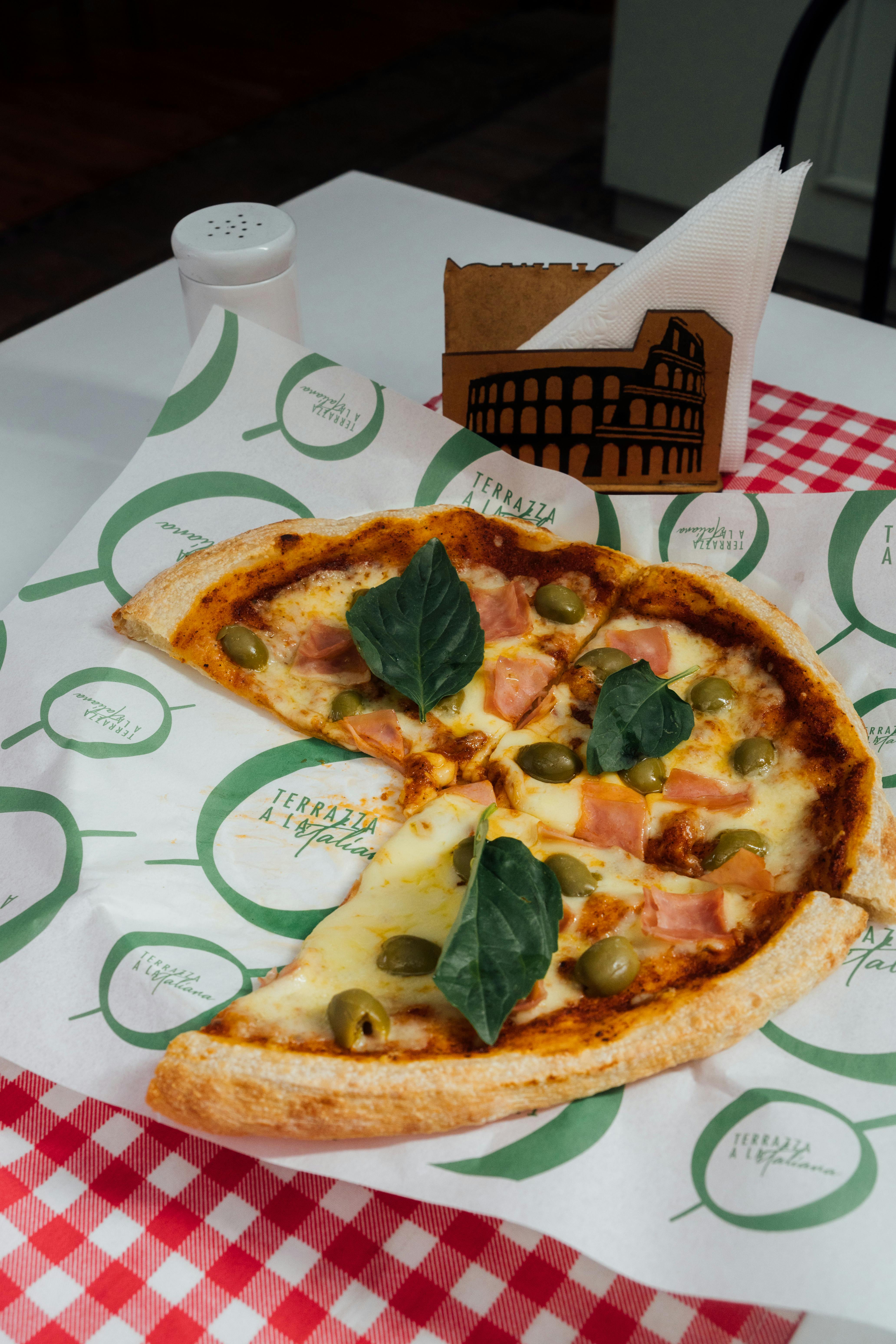 delicious pizza slice with toppings on table