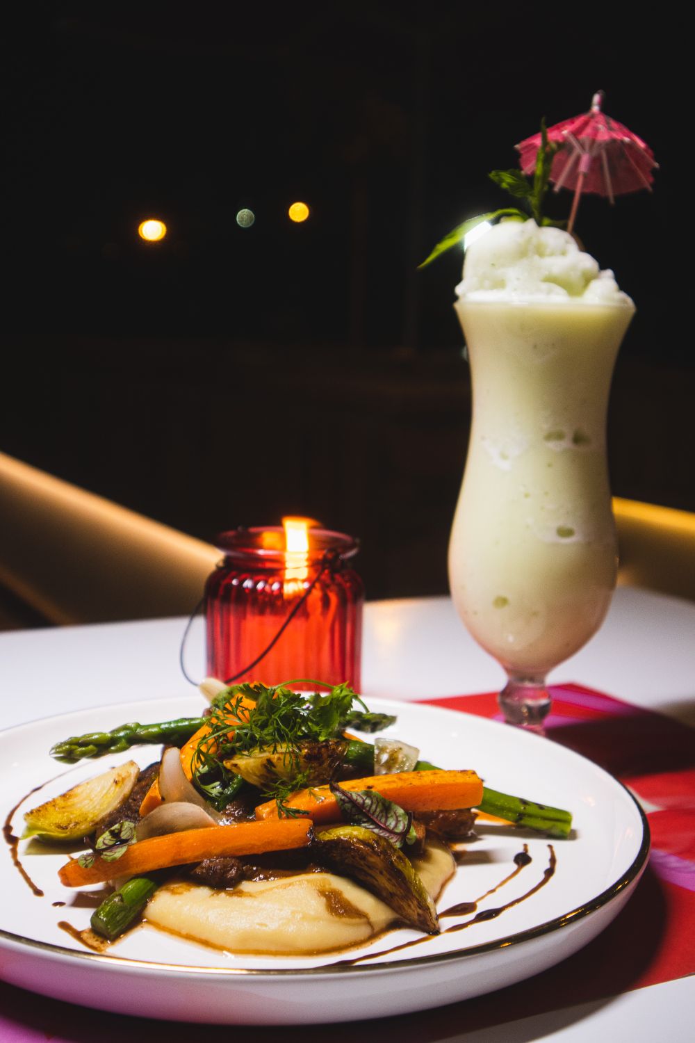 Gourmet Dinner Setup with Cocktail at Night · Free Stock Photo