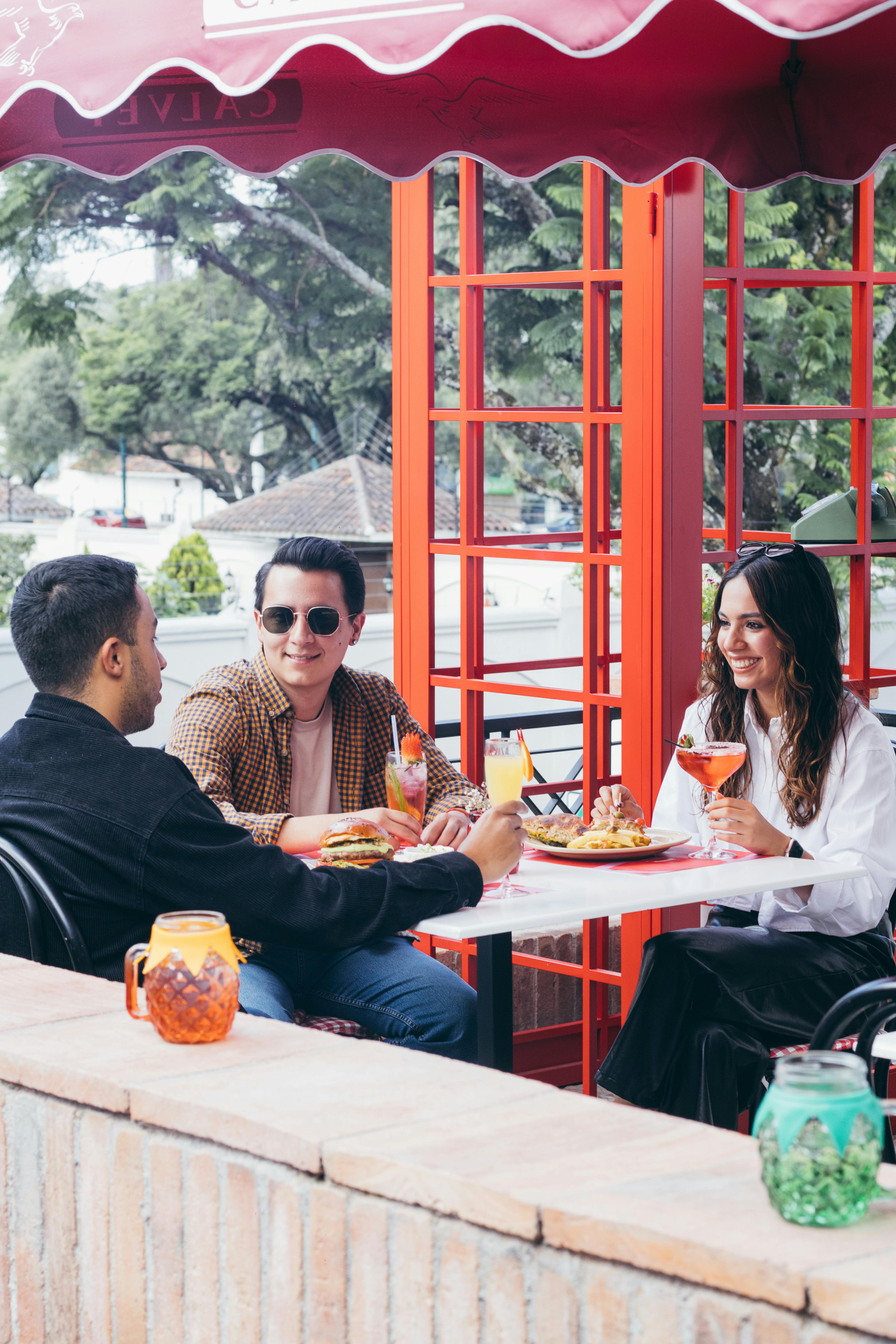 Friends meeting and connecting at restaurant table