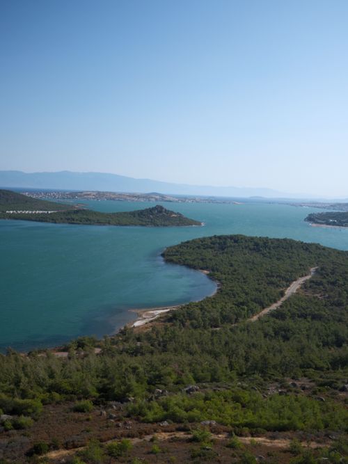 Free Aerial view of lush green islands in the Aegean Sea under clear blue sky. Stock Photo