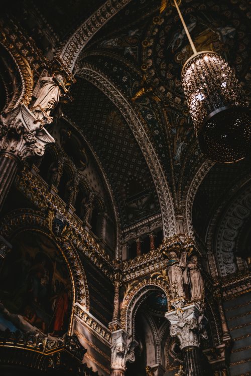 Free Explore the detailed architecture and rich decor of a baroque cathedral interior, captured from a low angle. Stock Photo
