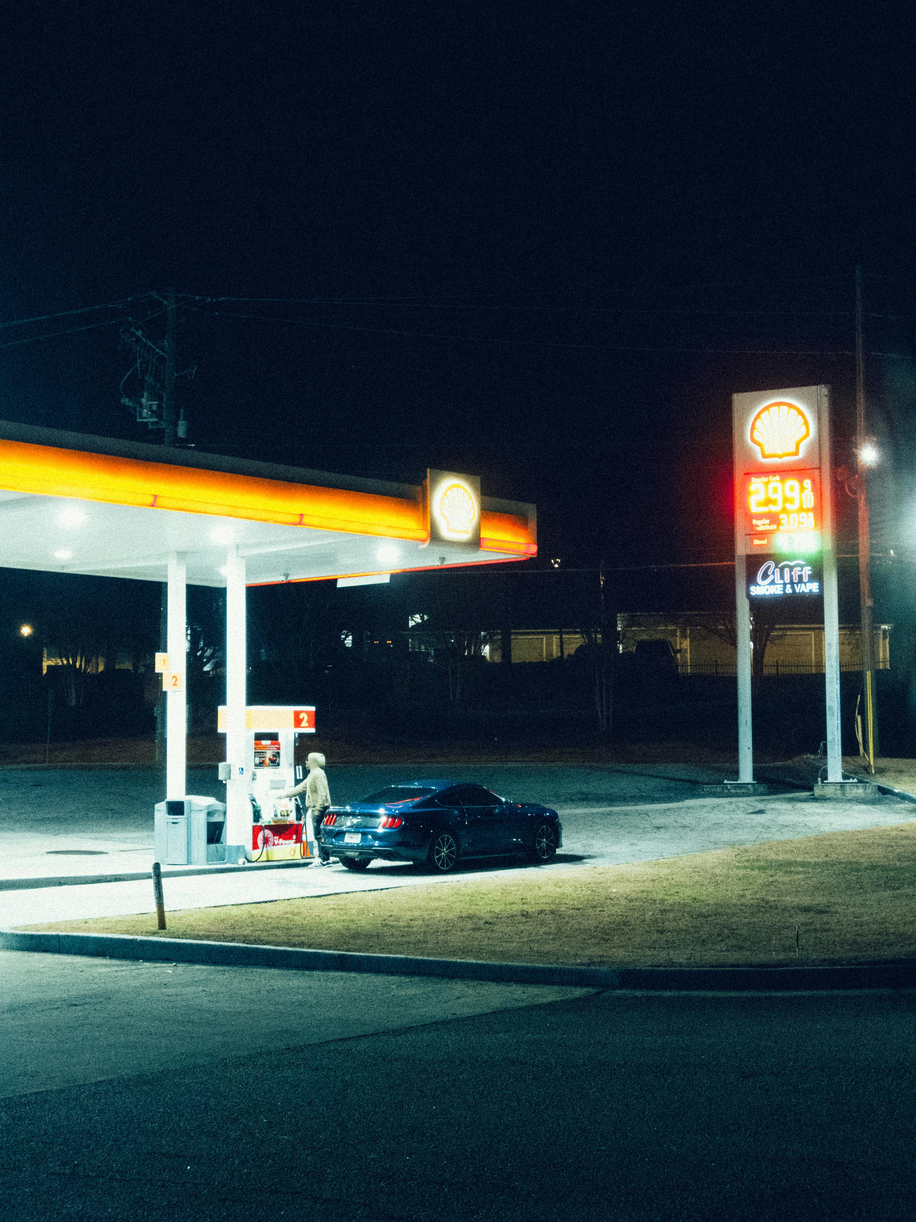 A car refueling at a Shell gas station at night in Atlanta, Georgia.