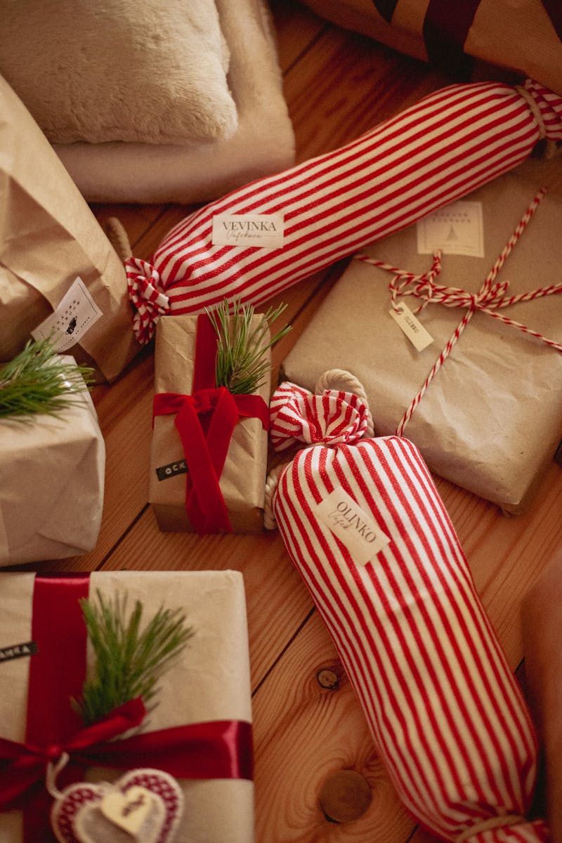 Cozy Christmas presents with red stripes and brown paper, perfect for the holiday spirit.