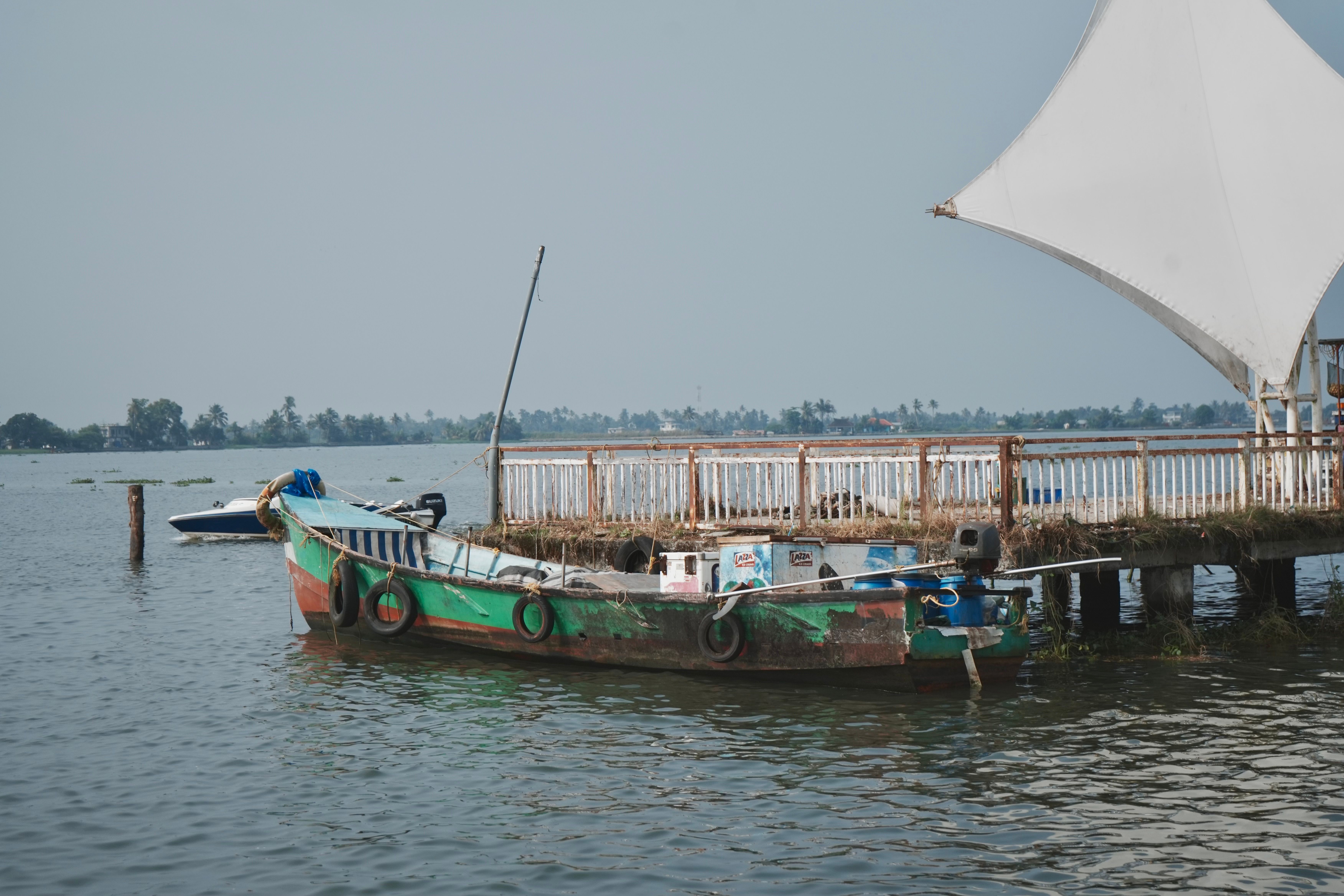 The Periyar river at Kodanad with country boats moored below the forest bank