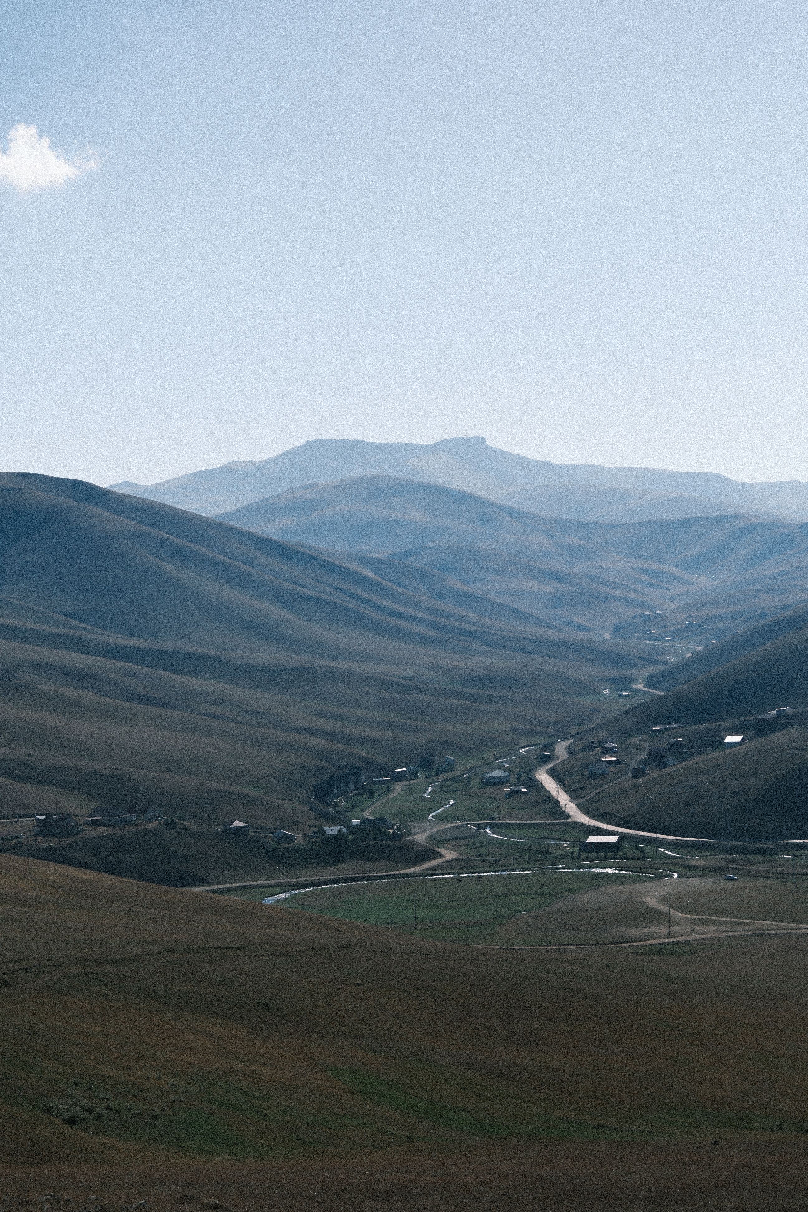 Serene Mountain Landscape with Rolling Hills · Free Stock Photo
