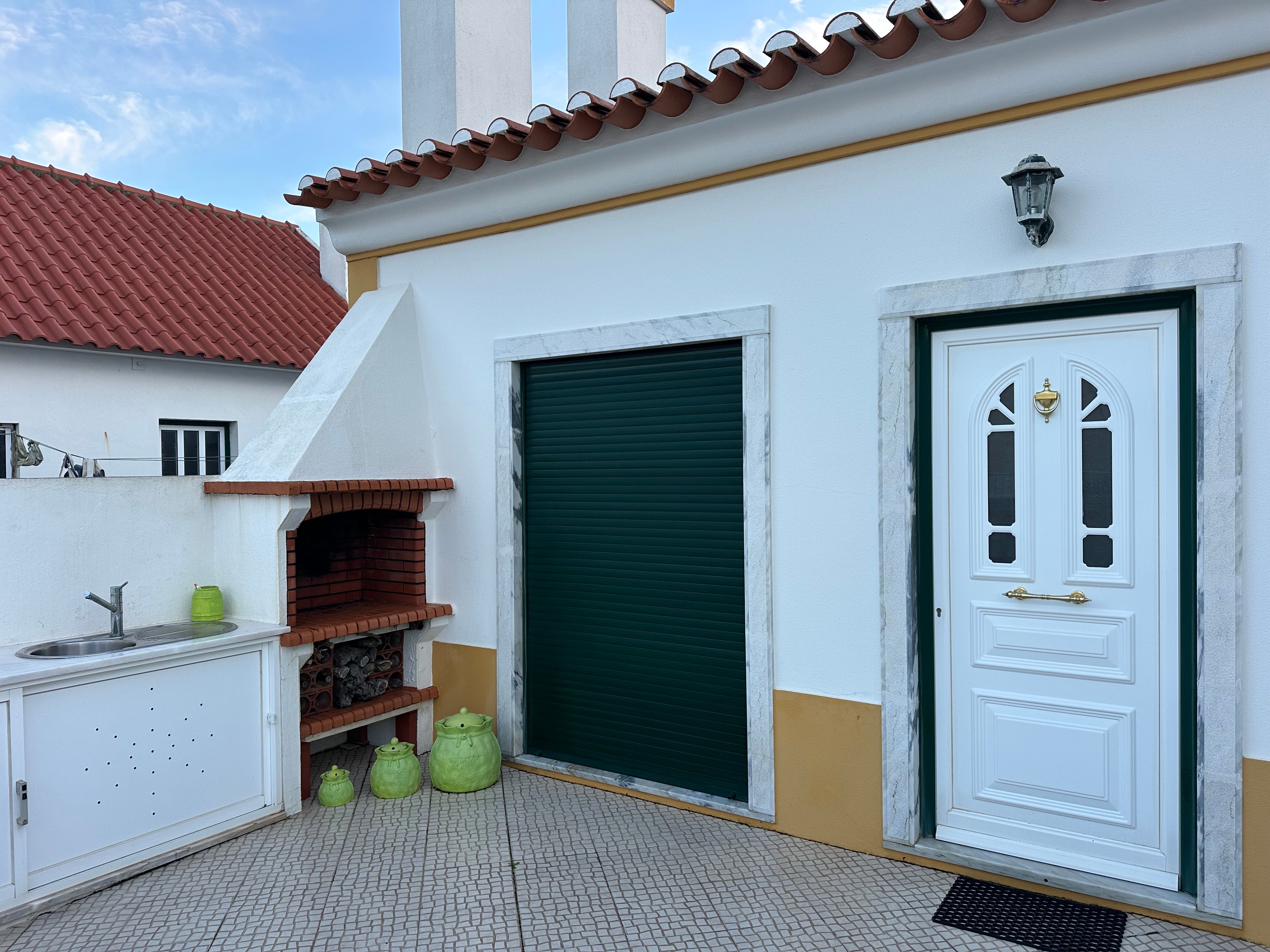 A freshly refurbished red-brick terraced house with a new front door
