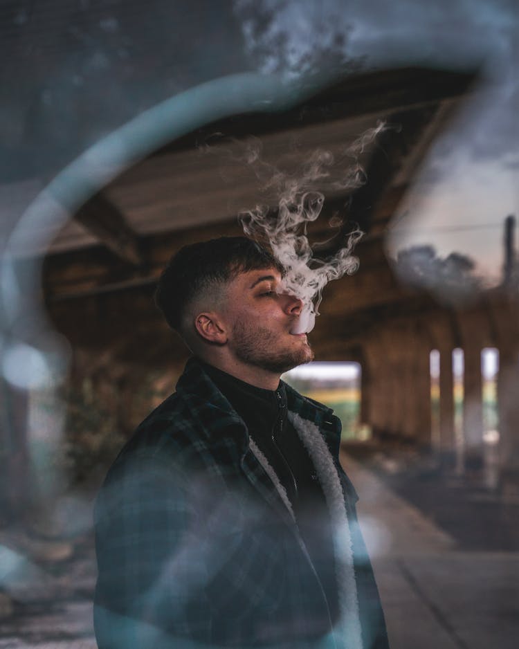 Selective Focus Photo Of Man Vaping