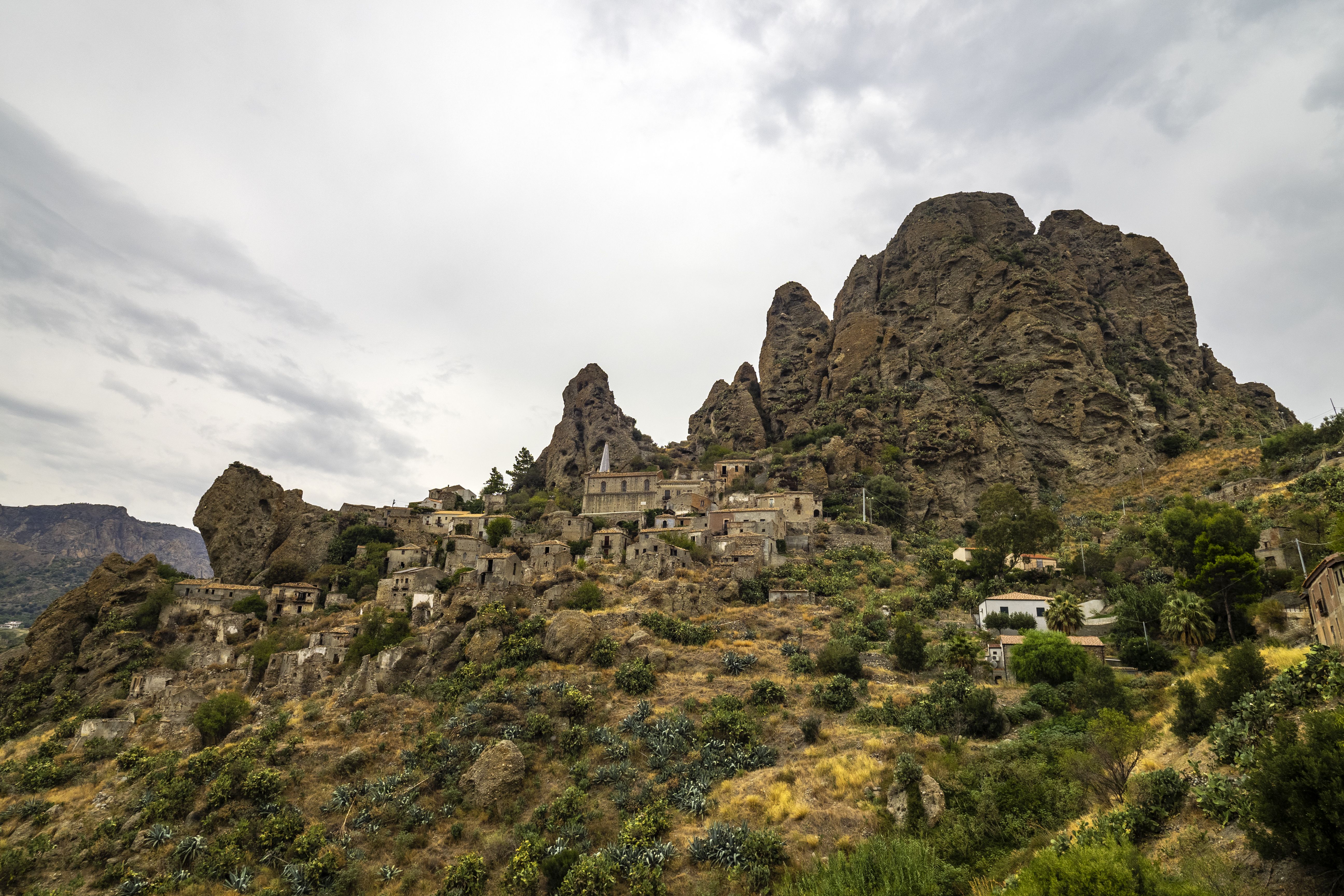 Ancient Rock Village in Scenic Mountain Landscape · Free Stock Photo