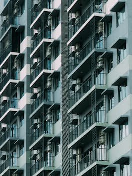 Symmetrical facade of modern apartments in Kuching, Sarawak, highlighting urban architecture.