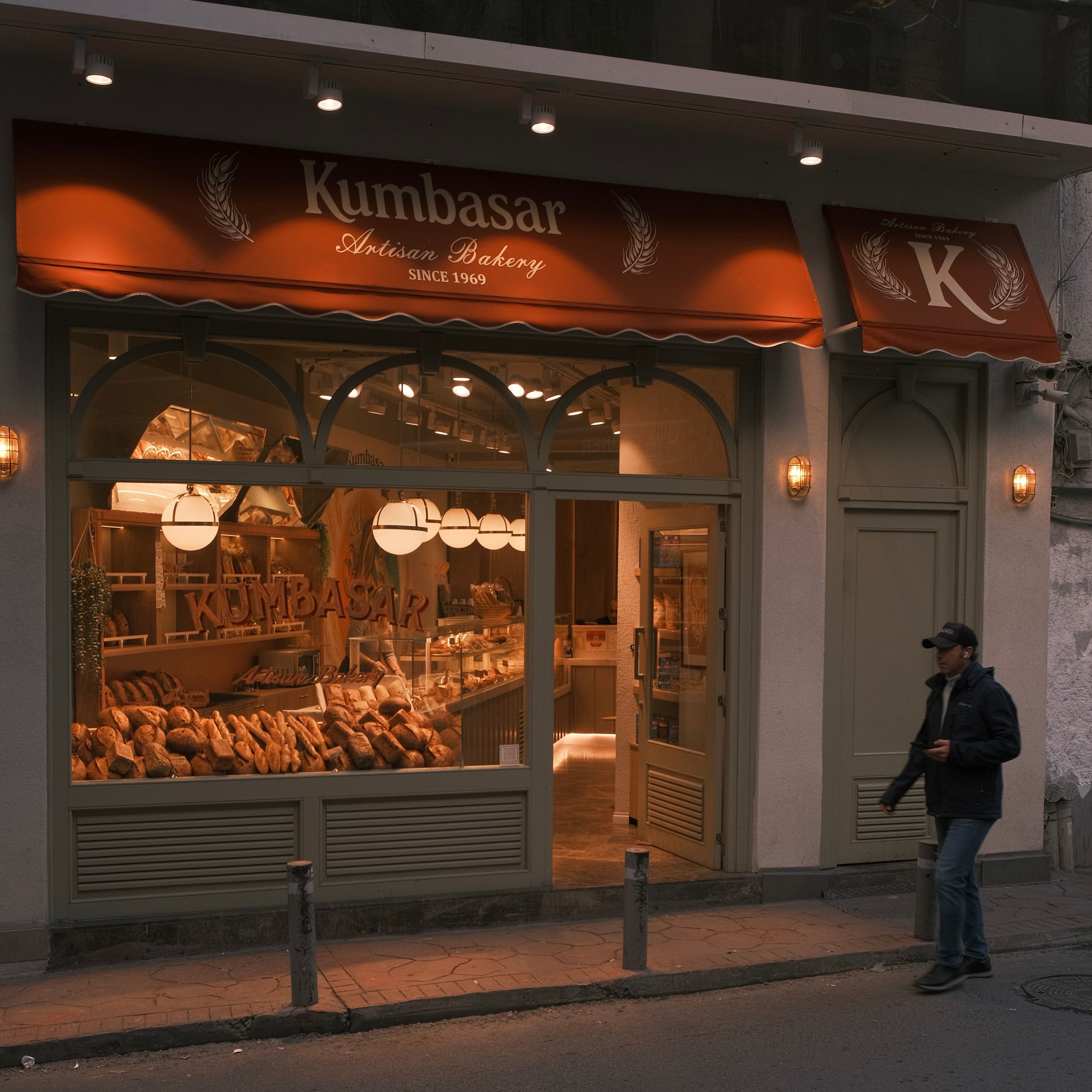 Artisan bakery storefront at dusk