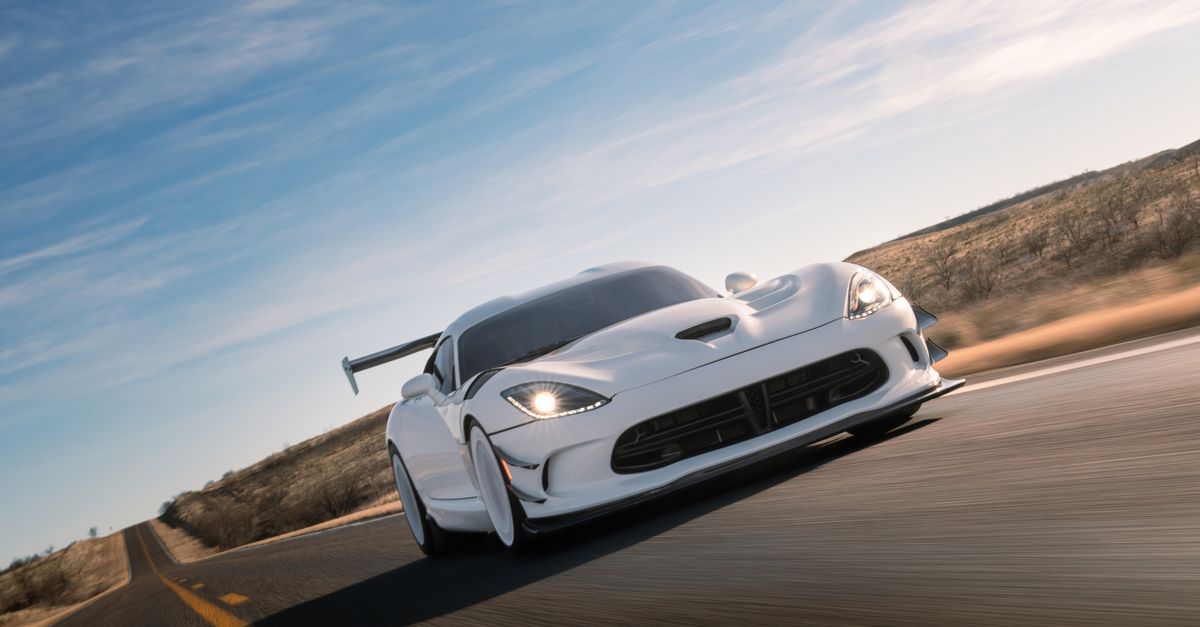 Select Car Racing Sleek Sports Car Racing on Desert Highway · Free Stock Photo