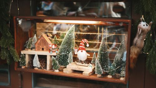 Free Festive miniature Christmas scene with Santa and trees in a wooden display box. Stock Photo