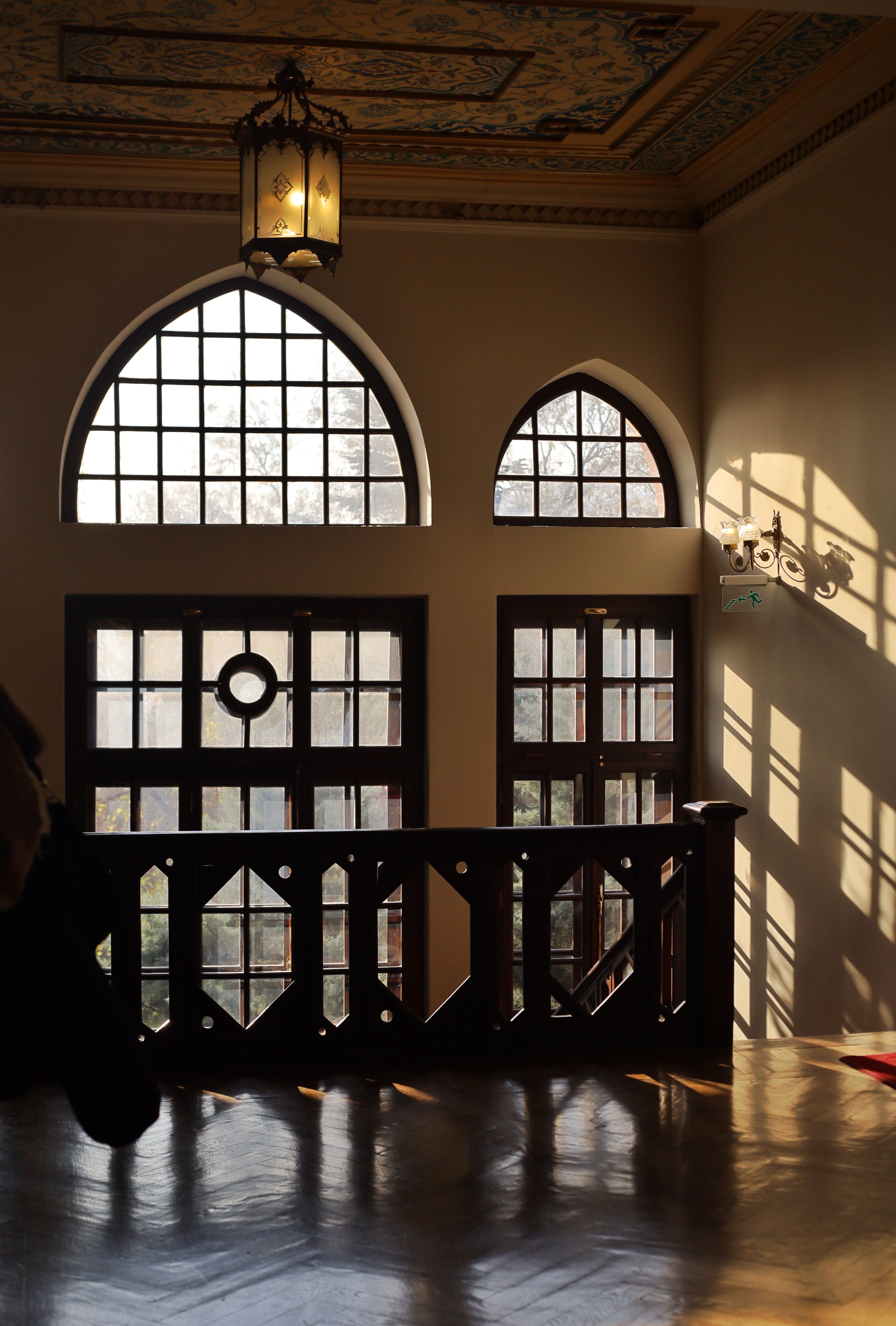 Elegant Interior with Sunlit Arched Windows · Free Stock Photo