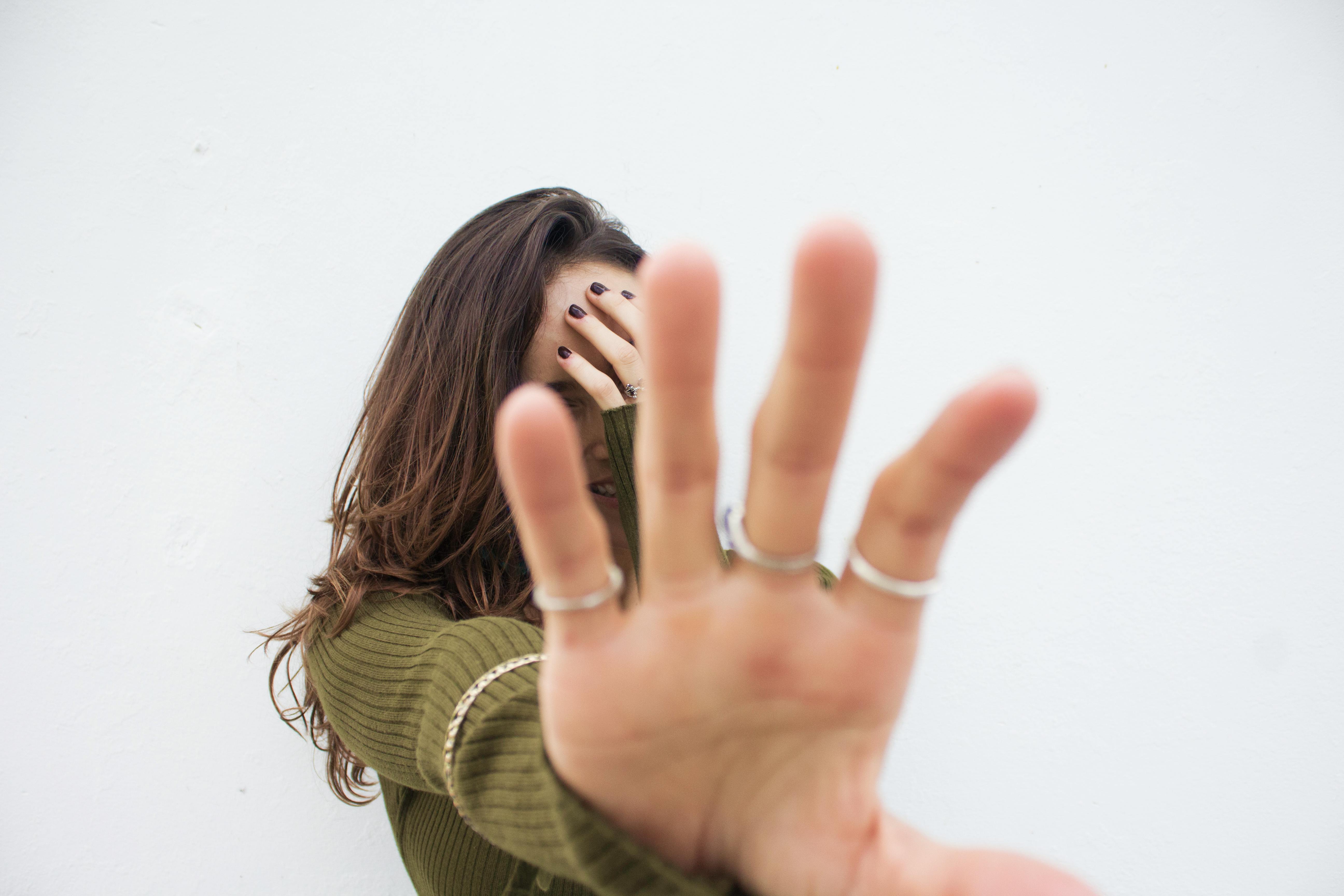 Woman with her hands over her face - a Royalty Free Stock Photo from  Photocase