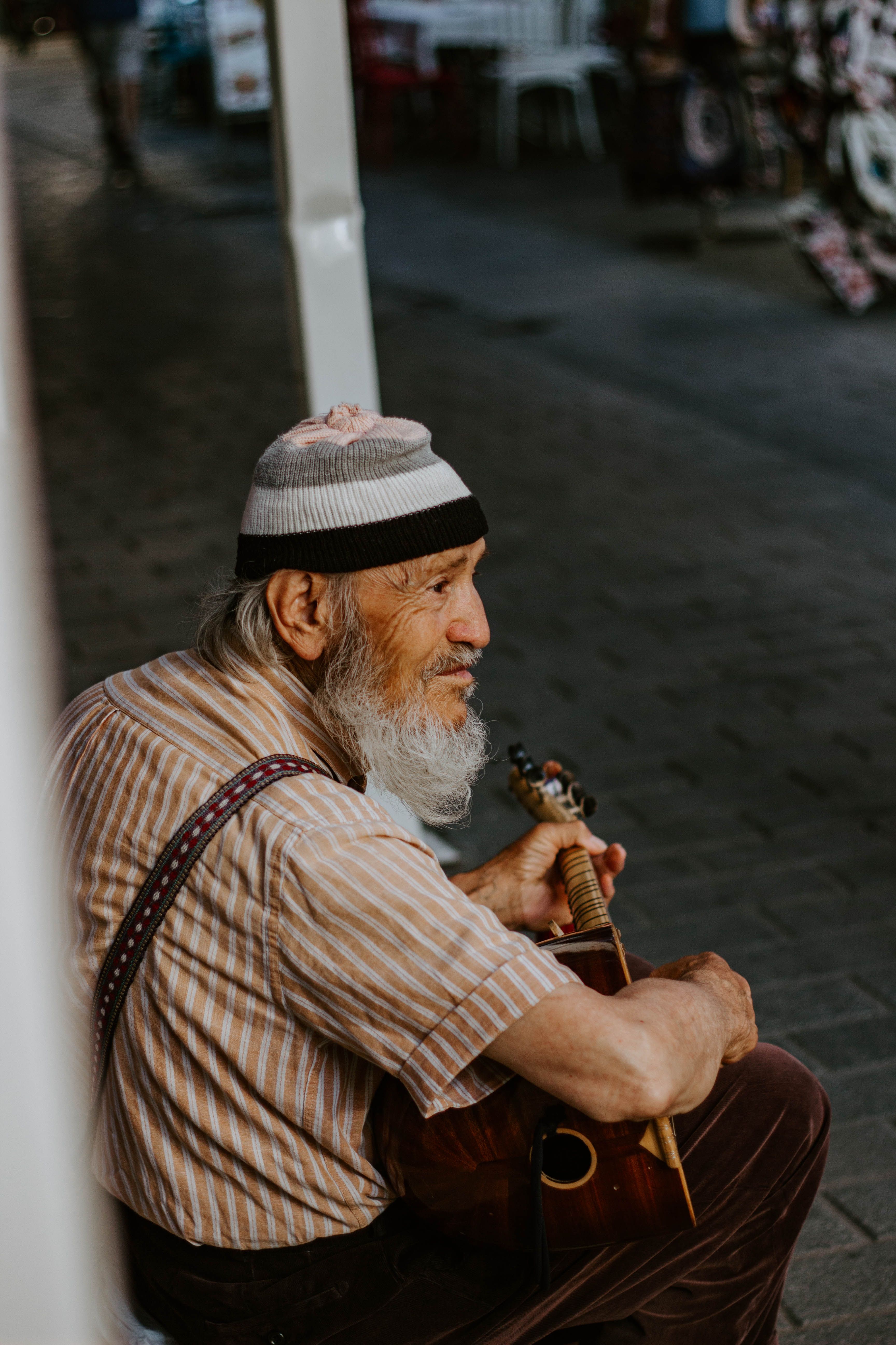 Elderly Musician Playing Instrument in Istanbul Street · Free Stock Photo