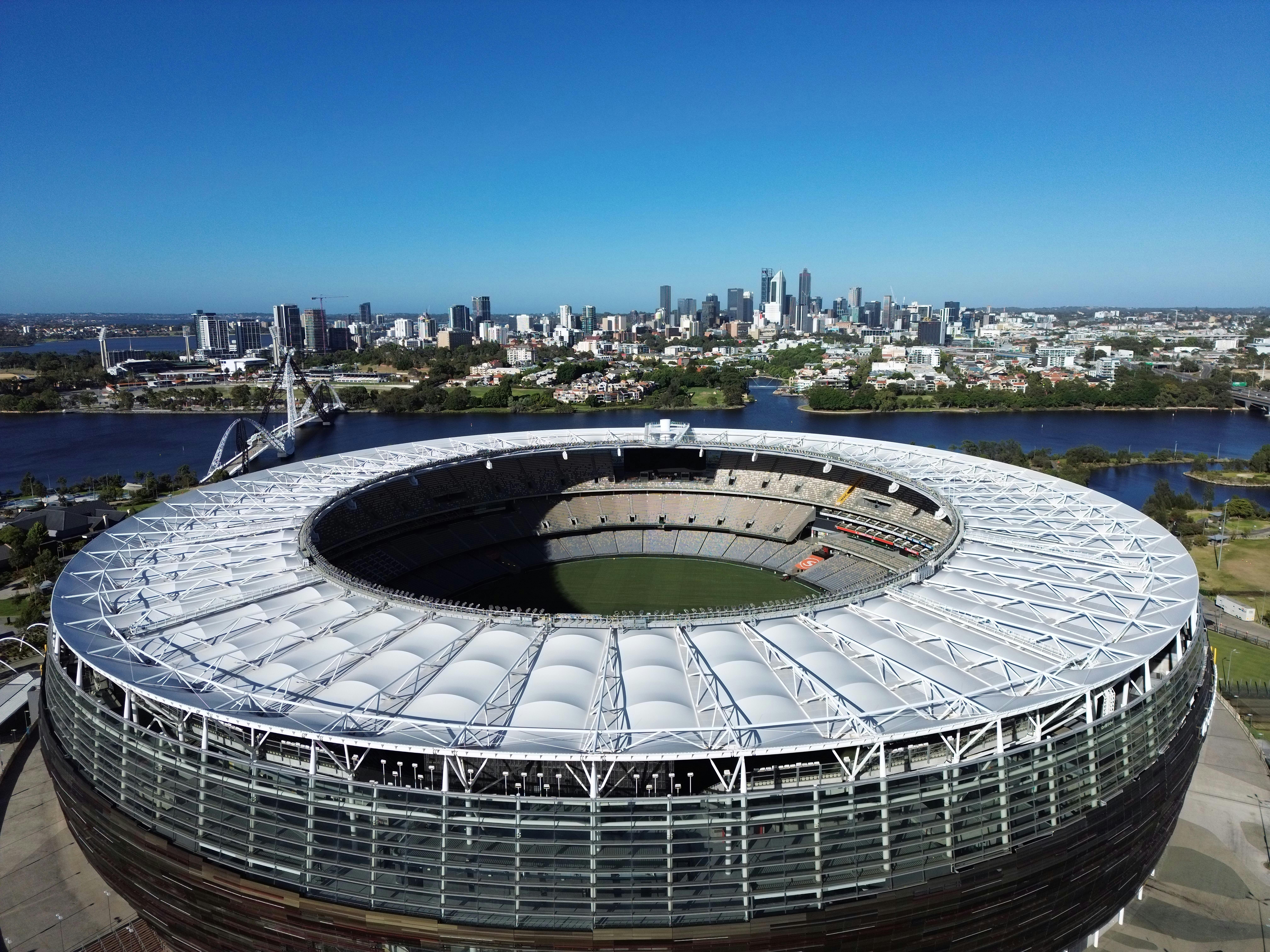 Stunning aerial view of Optus Stadium in Perth, Western Australia with city skyline backdrop.