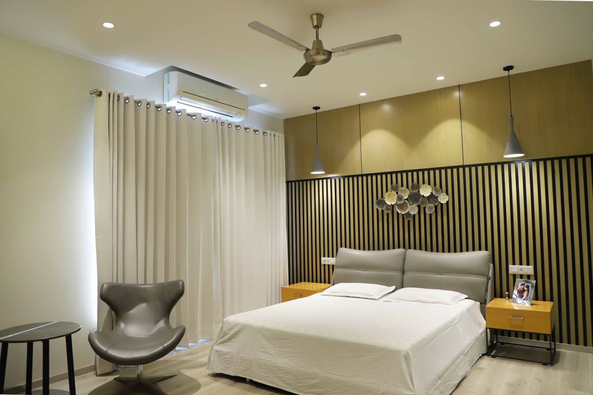 Elegant modern bedroom with layered interior lighting