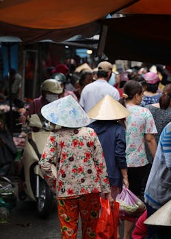 A bustling street market filled with locals in traditional hats, showcasing cultural vibrancy.