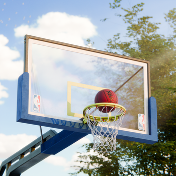 A basketball going through a hoop on an outdoor court in İzmir, Türkiye.