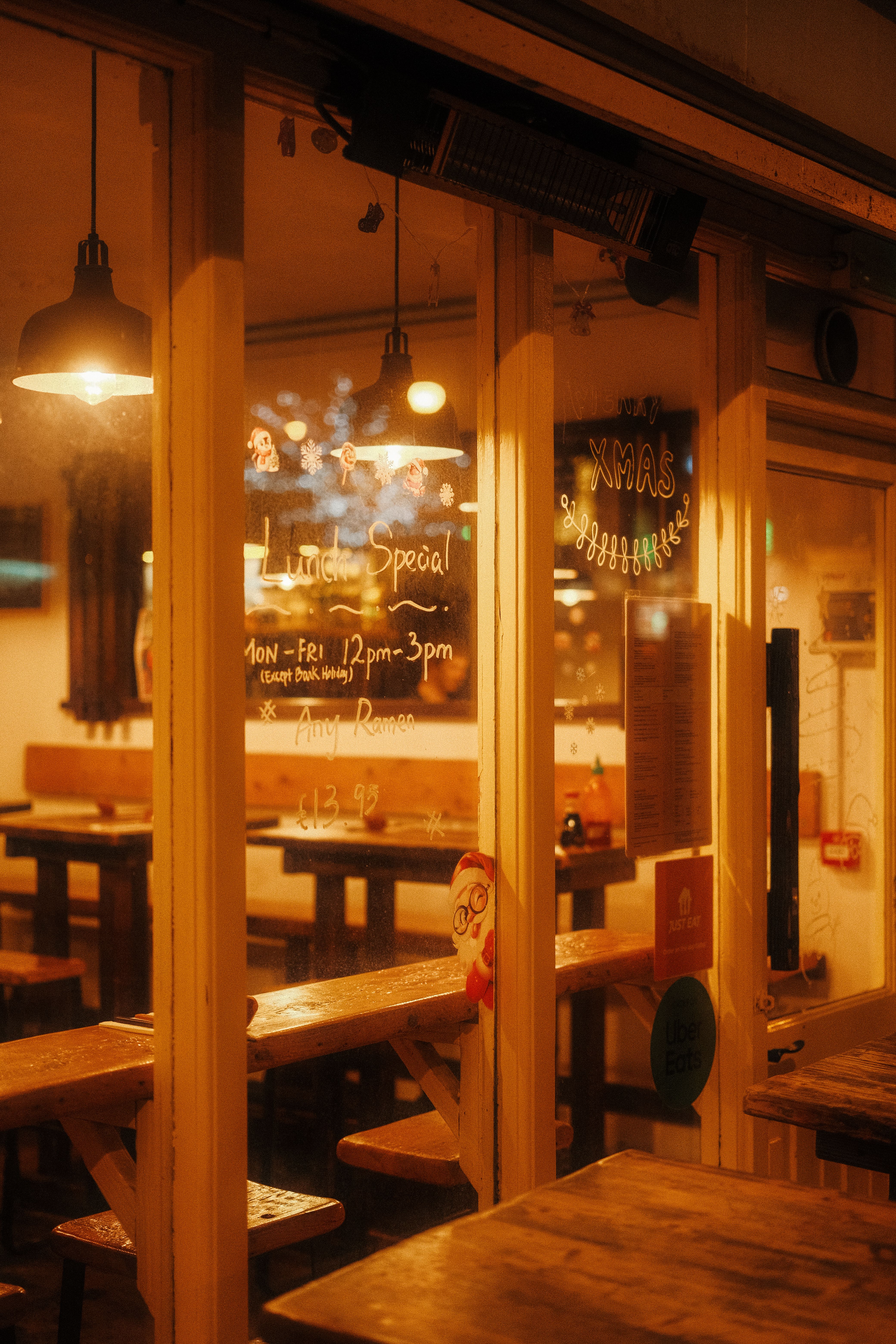 Cozy Restaurant Window Decorated for Christmas · Free Stock Photo