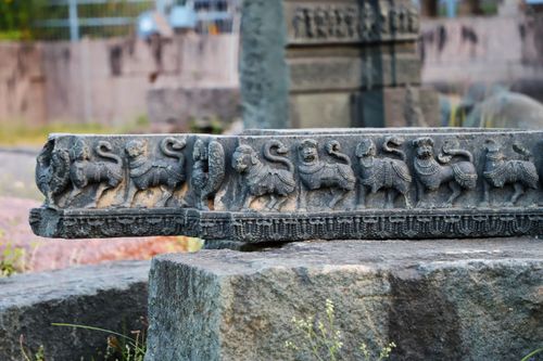 Free Detailed view of ancient stone carvings depicting mythical creatures on a historic monument. Stock Photo