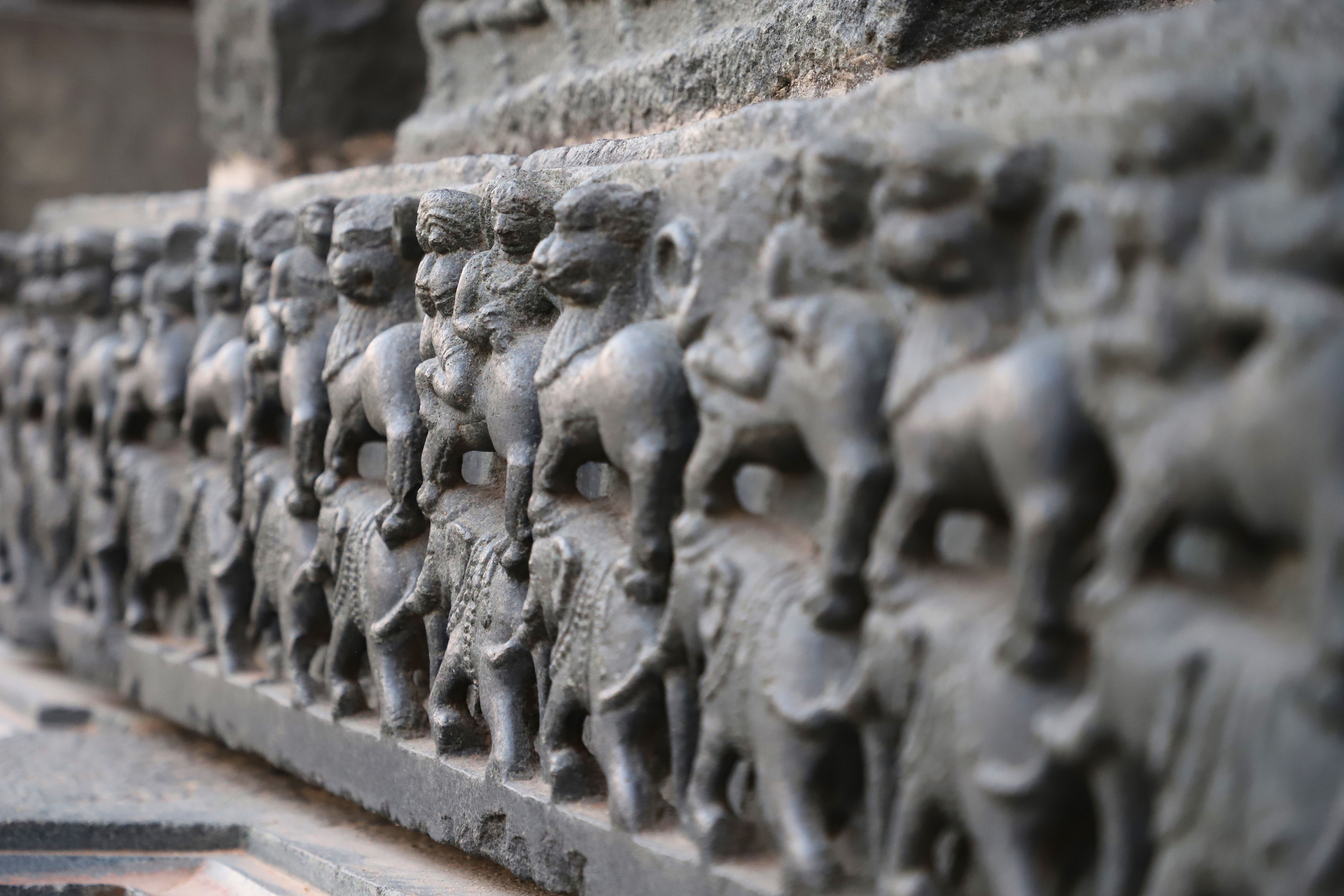 Intricate Stone Carvings on Ancient Temple Wall · Free Stock Photo