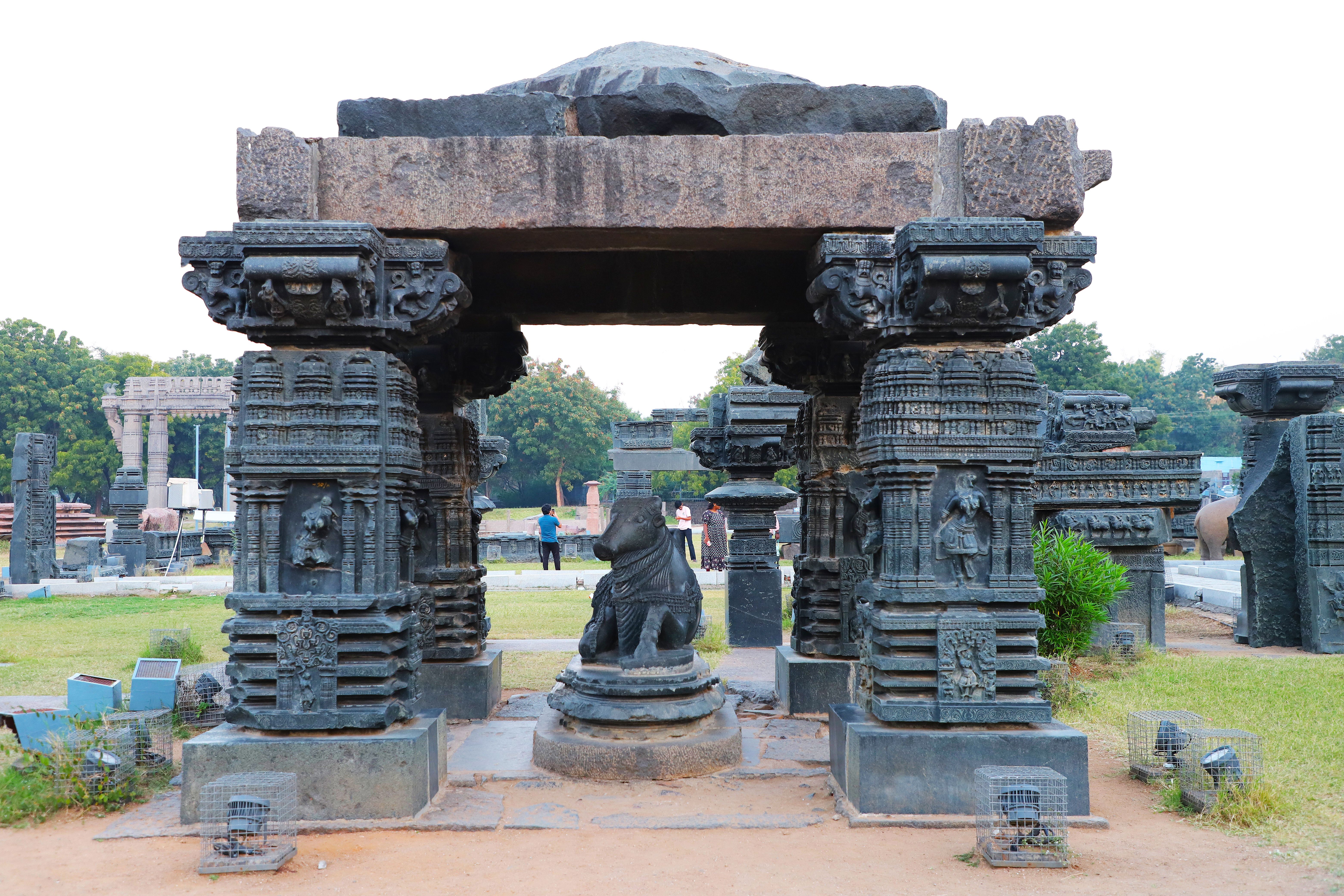 Ancient Stone Structure with Sculpture in Park · Free Stock Photo