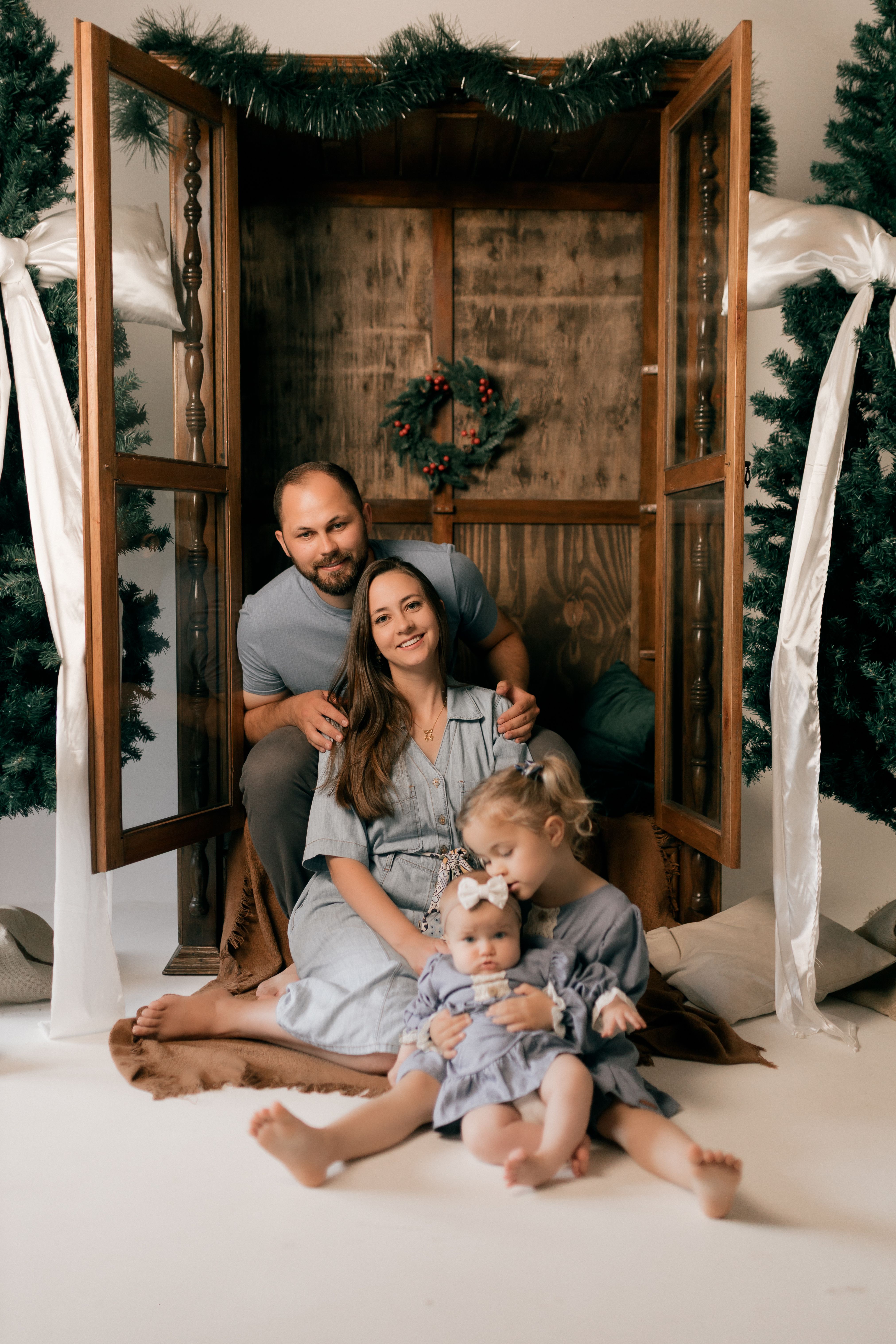 Cozy Family Portrait in Holiday Setting · Free Stock Photo