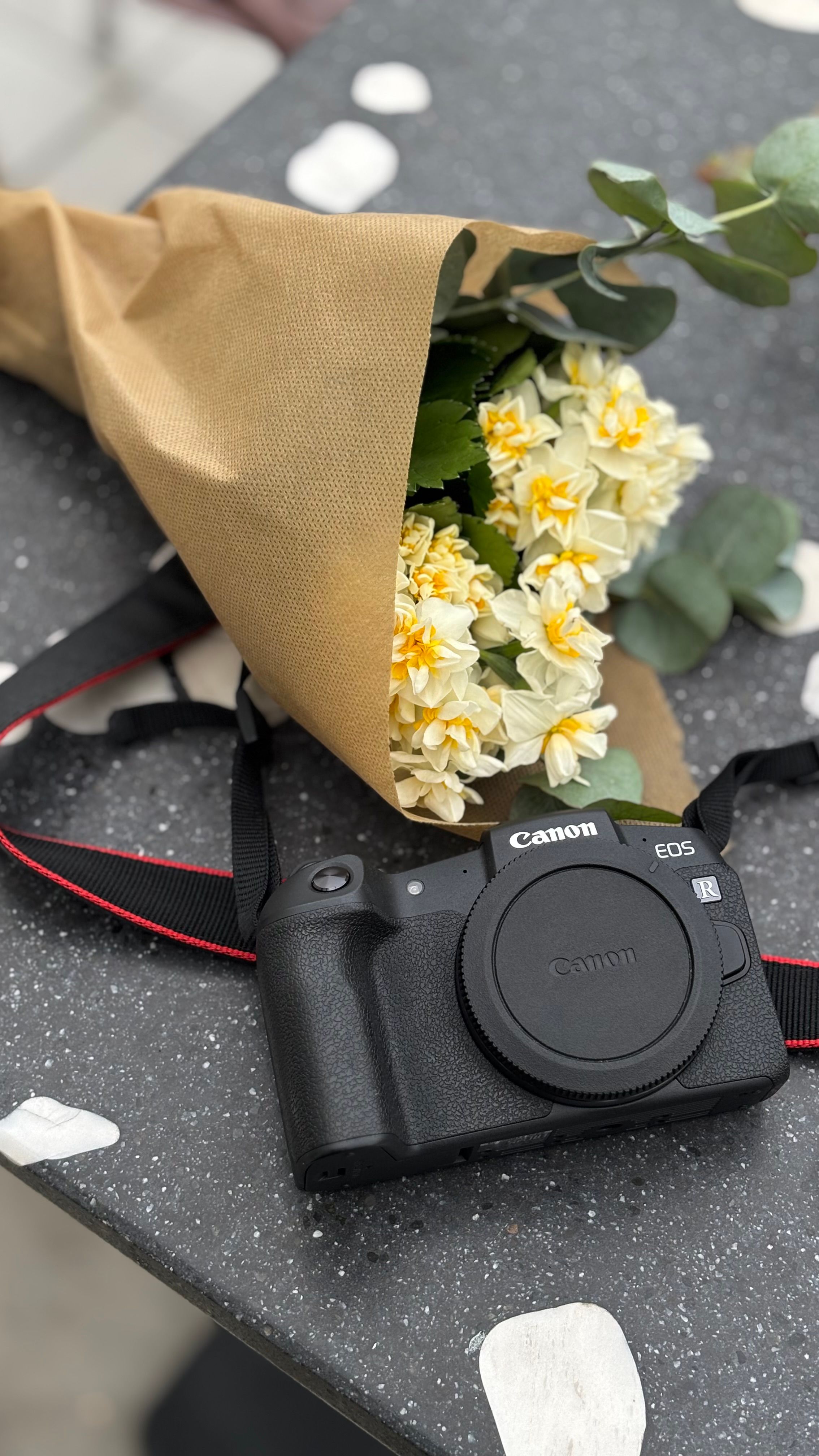 Camera and Bouquet on Stone Table Setting · Free Stock Photo