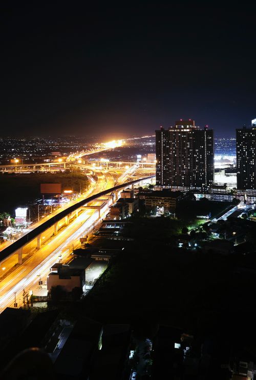 Free A stunning night view of illuminated highways and skyscrapers in Bangkok, Thailand. Stock Photo