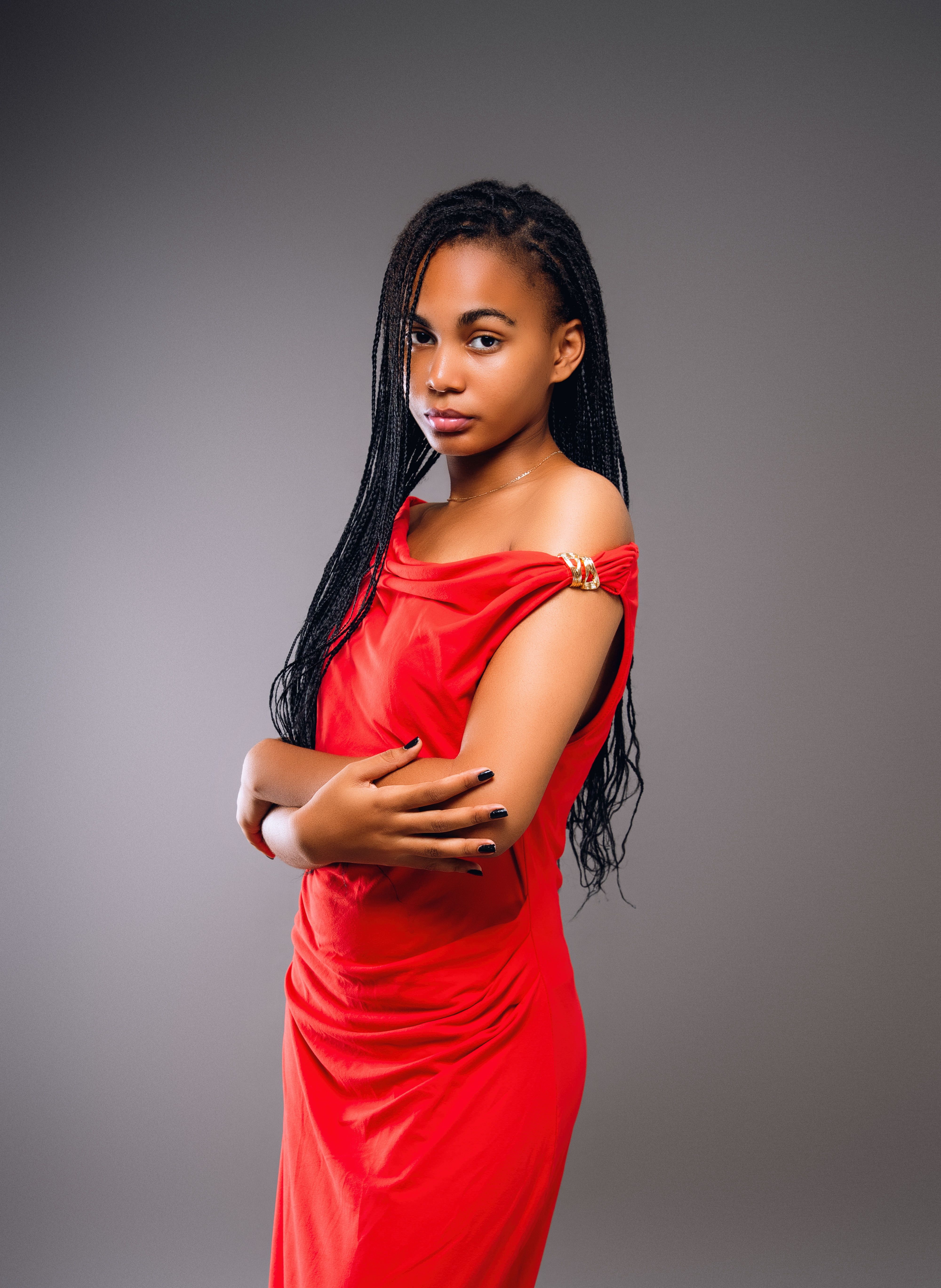Elegant Black Woman in Red Off-Shoulder Dress  Free Stock Photo