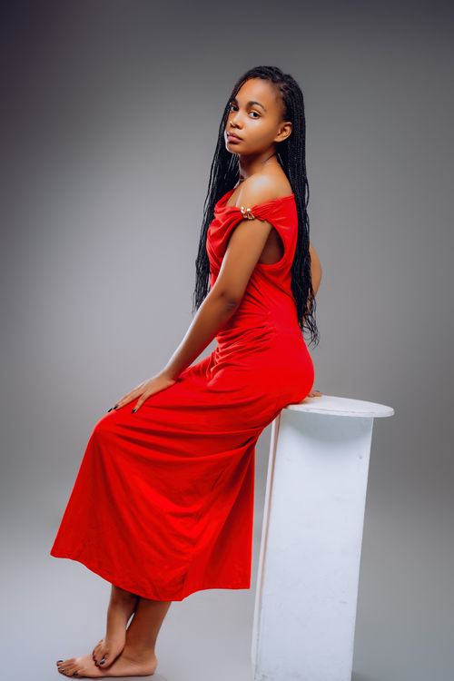 black model in red dress Stylish african american woman in a red dress on Craiyon