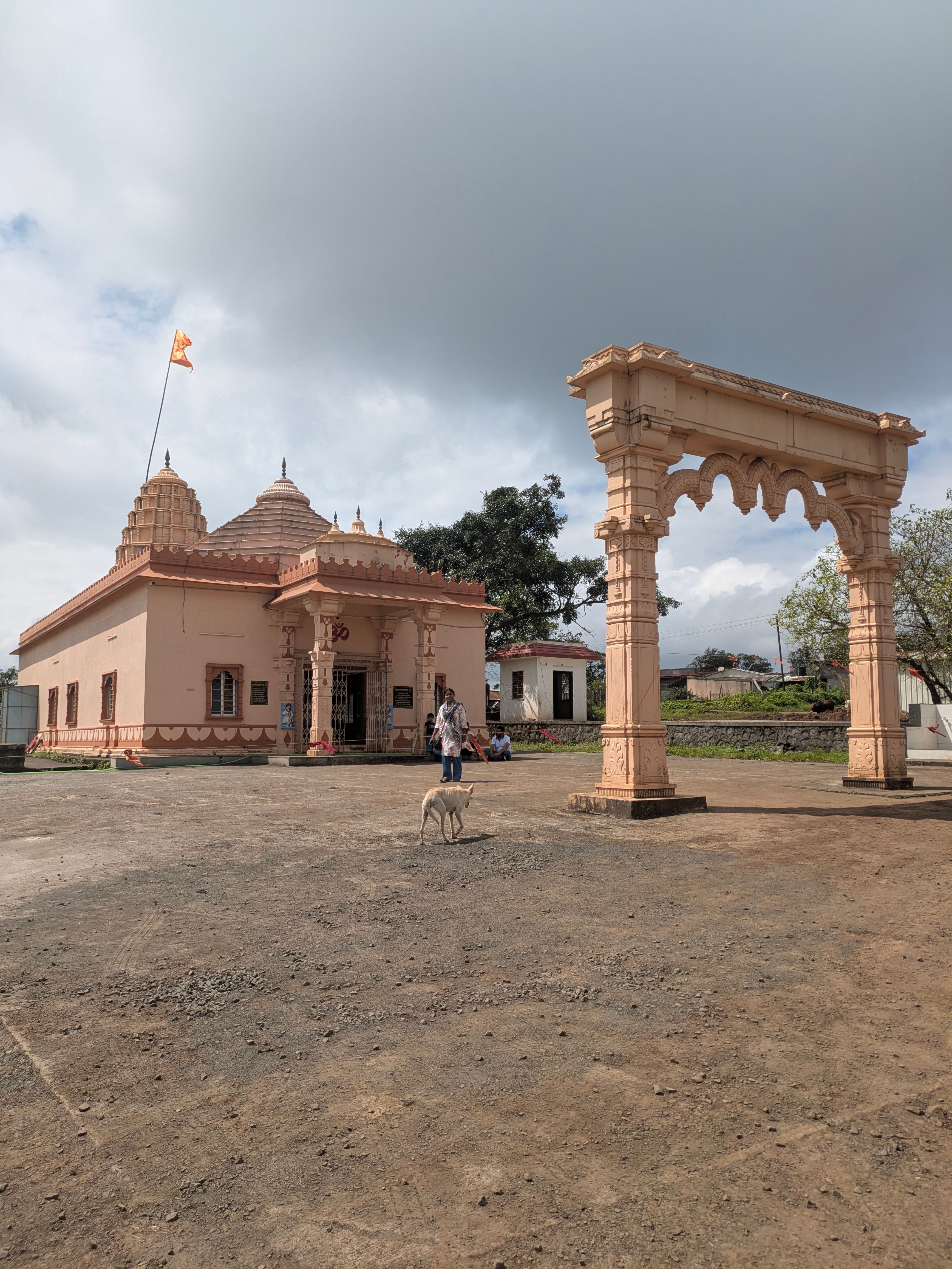 A serene temple with archway under a bright sky, capturing traditional architecture and cultural essence.