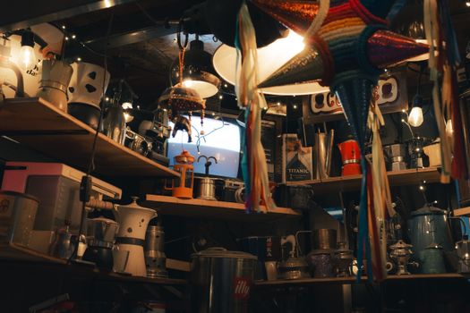 A charming vintage cafe filled with eclectic decor, warm lighting, and cozy corners.