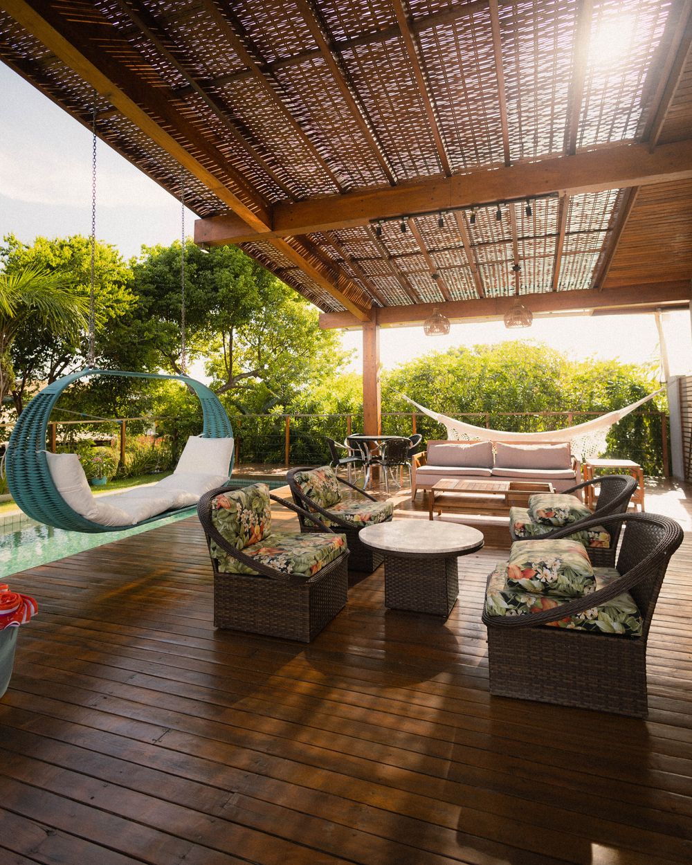 Elegant modern outdoor patio with wooden deck and comfortable seating