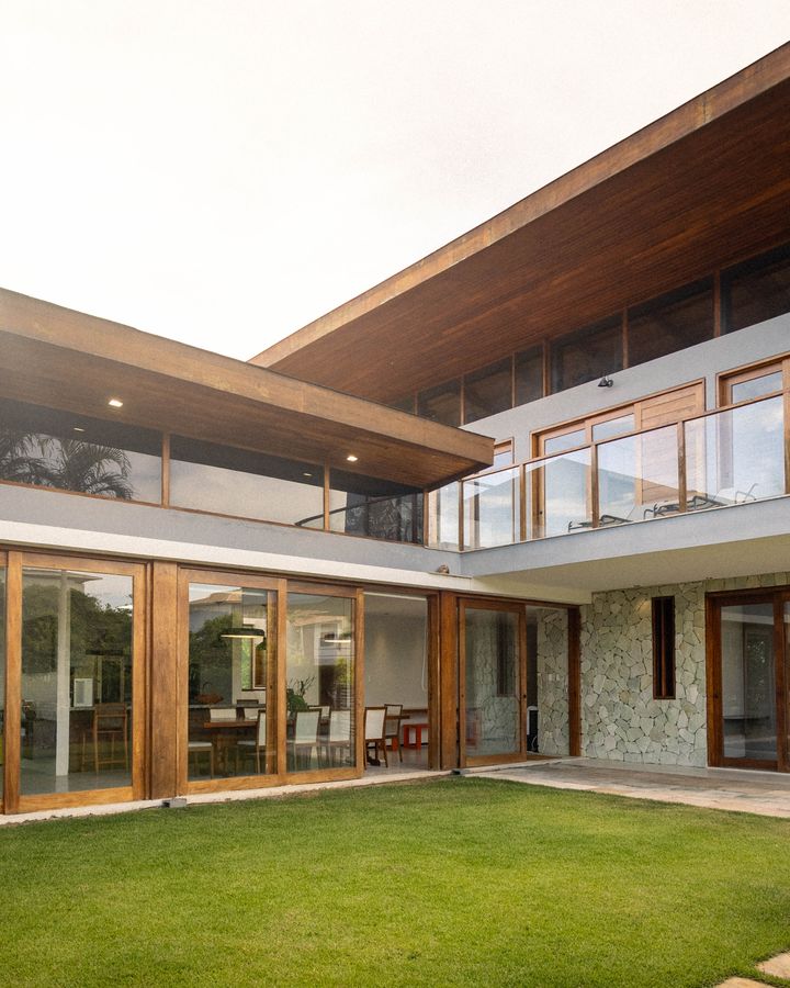 Luxury modern house exterior with glass windows and wooden finish