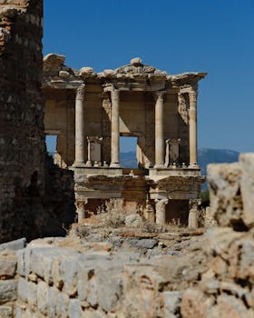 Explore the ancient ruins of Celsus Library in Ephesus under a clear blue sky.