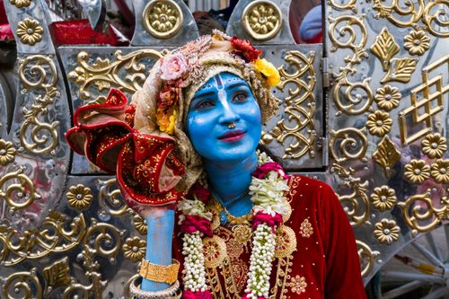 Free A vibrant portrayal of a person dressed as Lord Krishna during a festival celebration in Dhaka, Bangladesh. Stock Photo
