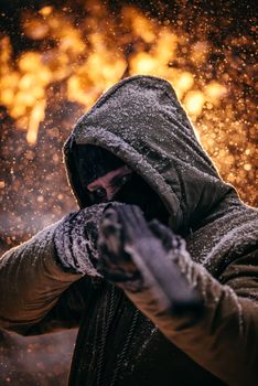 Shallow Focus Photo of Person Wearing Gray Hoodie Holding Black Rifle