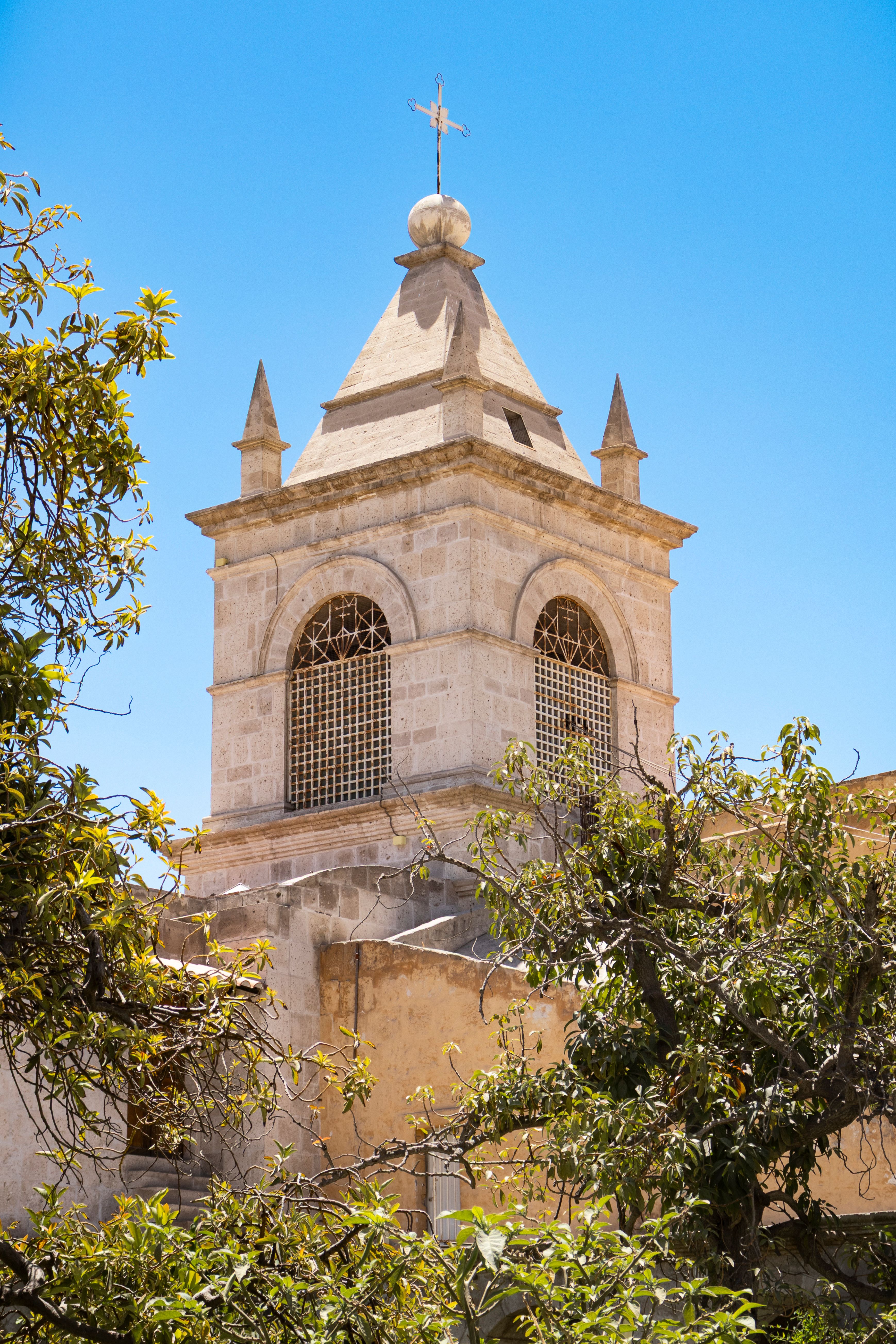 Historic Bell Tower Against Clear Blue Sky · Free Stock Photo