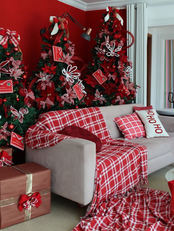 layered-christmas-textures Sofa layered with a red plaid Christmas throw and festive cushions
