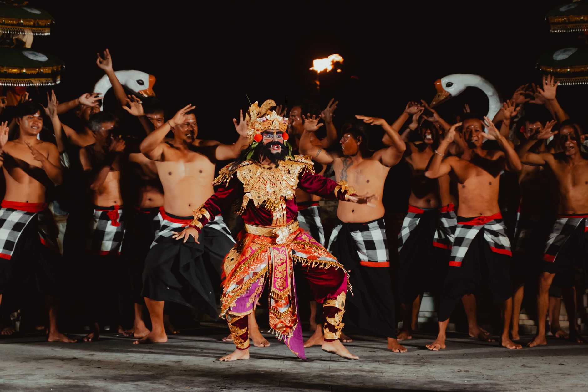 Nighttime performance of Kecak dance in Bali, Indonesia, showcasing traditional costumes and cultural heritage.
