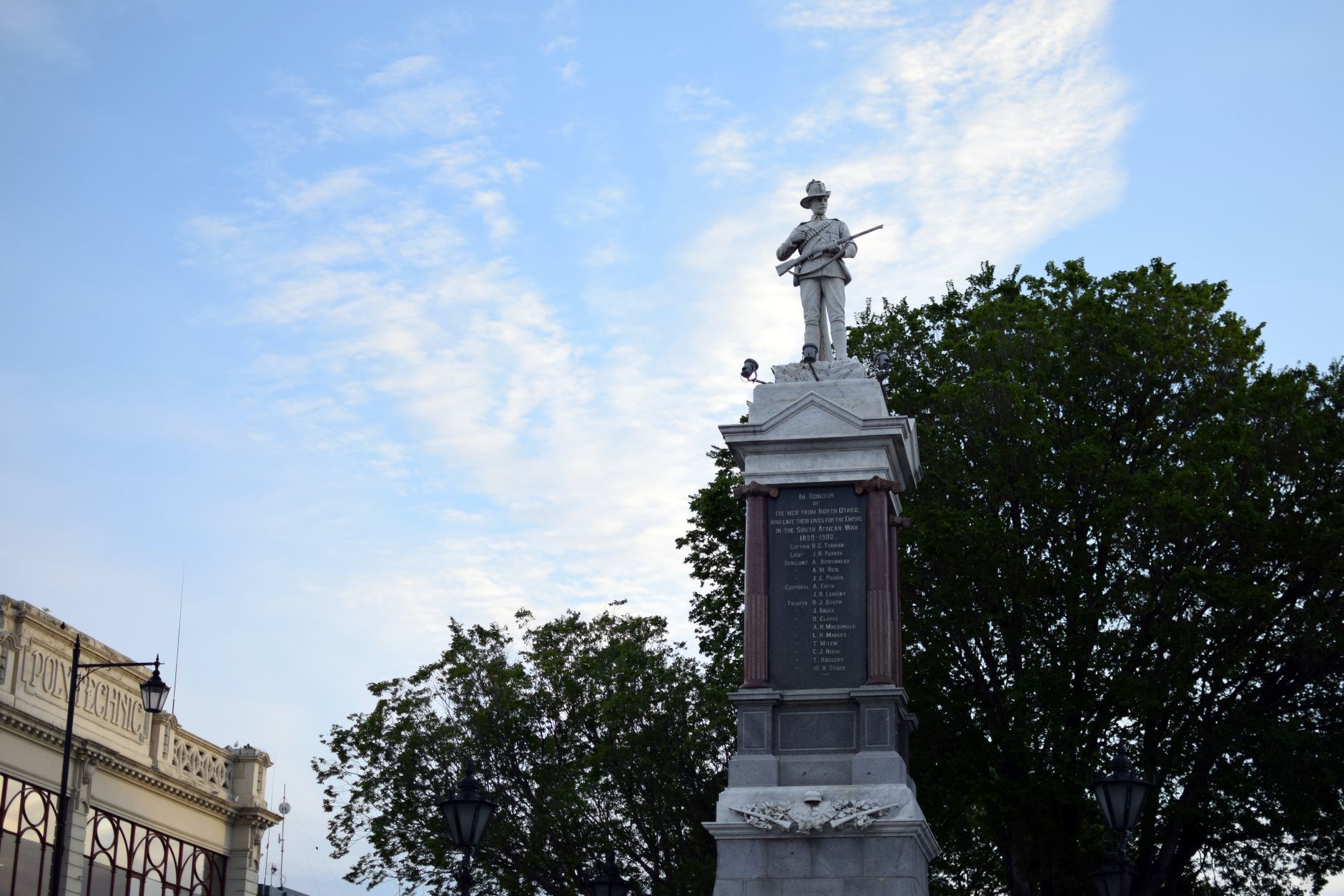 A classic war memorial statue in Otago, captured on a clear day.