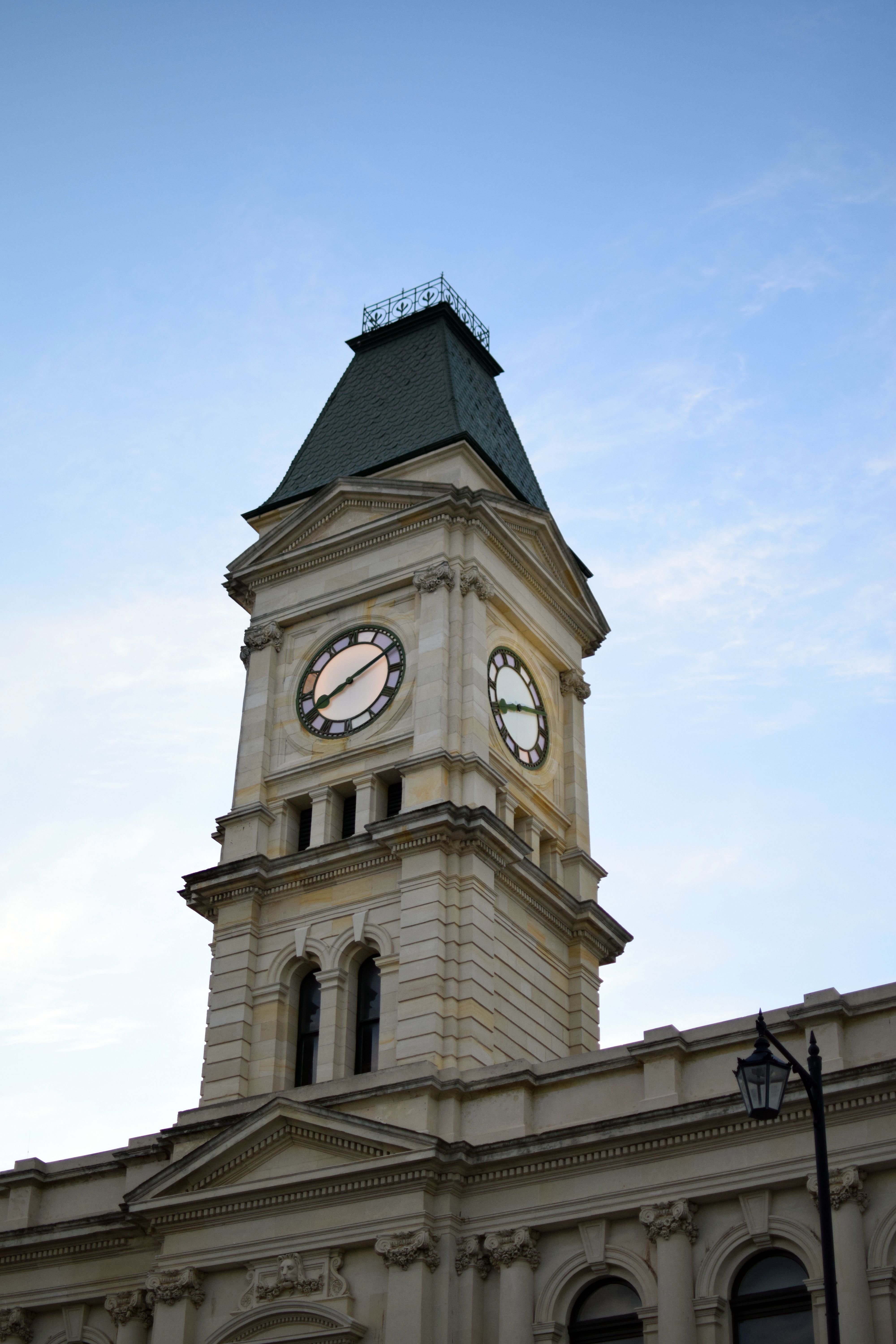 Historic Clock Tower Against Blue Sky · Free Stock Photo