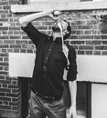 Man in Black Dress Shirt Drinking Canned Drink