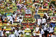 Vibrant parade in Jawa Timur, Indonesia showcasing traditional offerings and local culture.