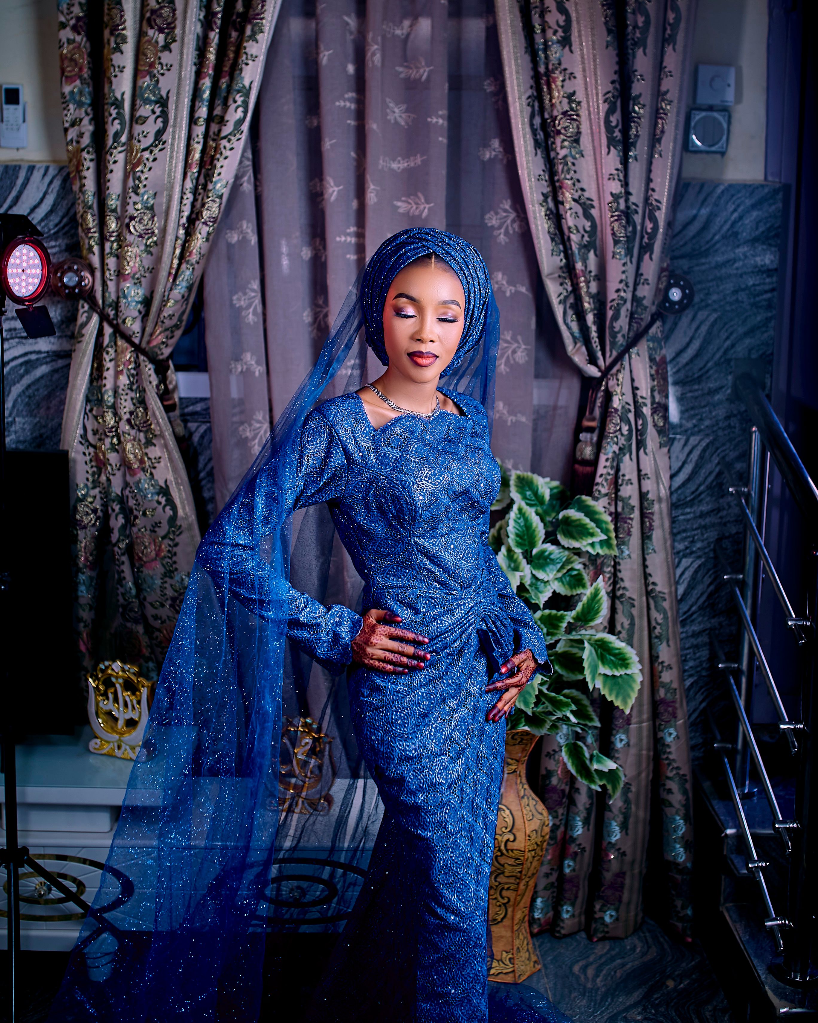 Elegant Woman in Blue Gown Indoors · Free Stock Photo