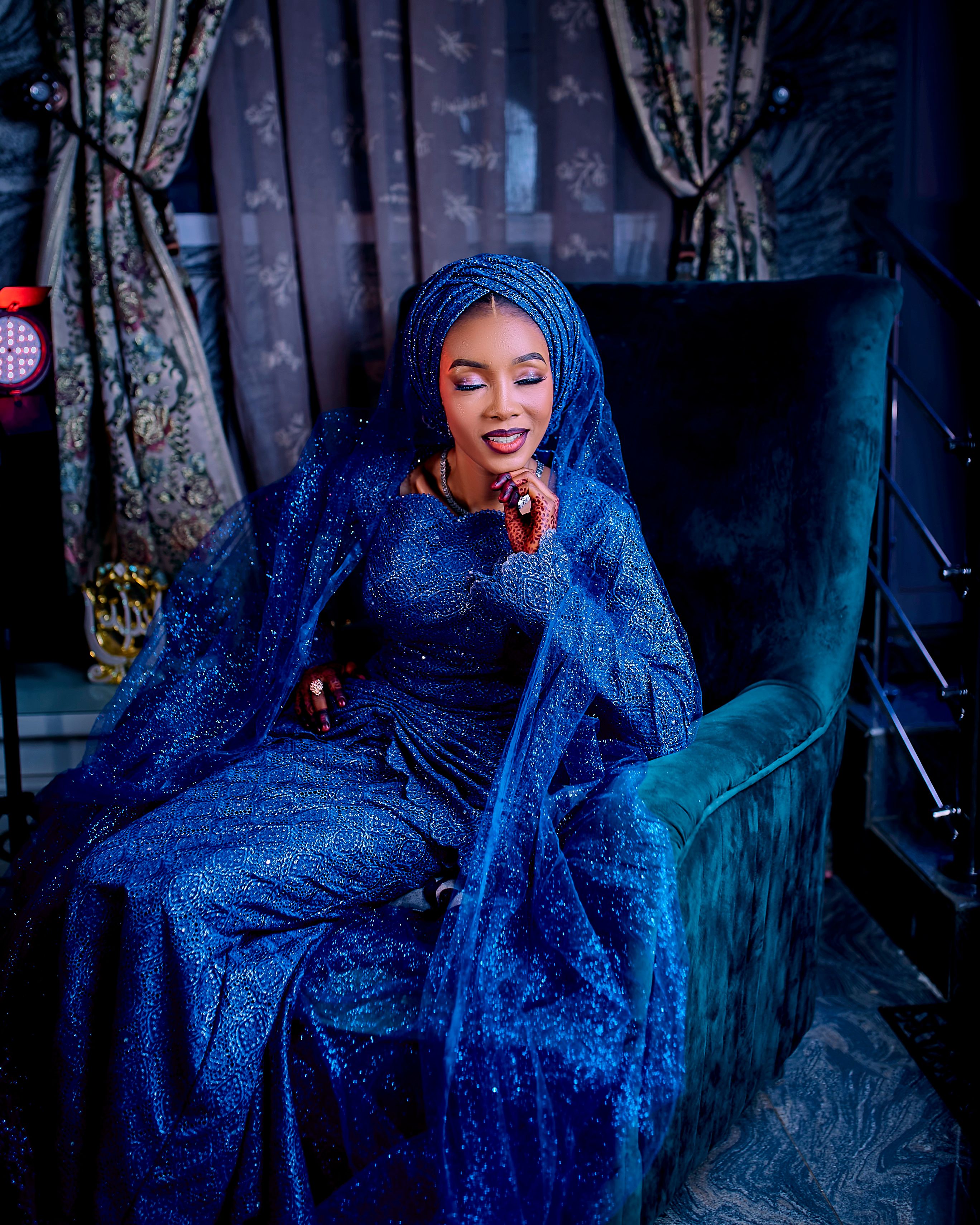 Elegant Woman in Sparkling Blue Gown Indoors · Free Stock Photo
