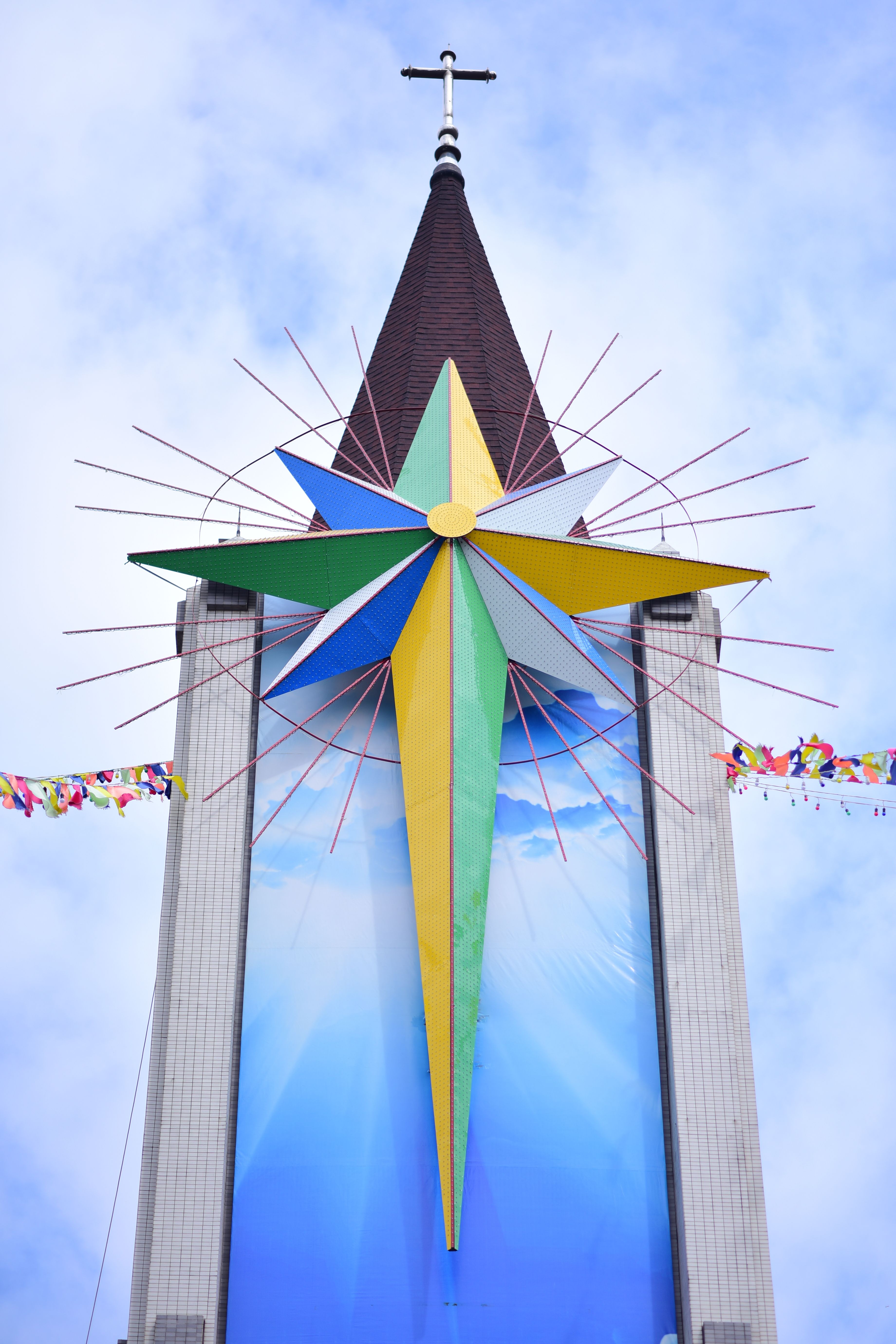 Colorful Star Installation on Church Spire · Free Stock Photo